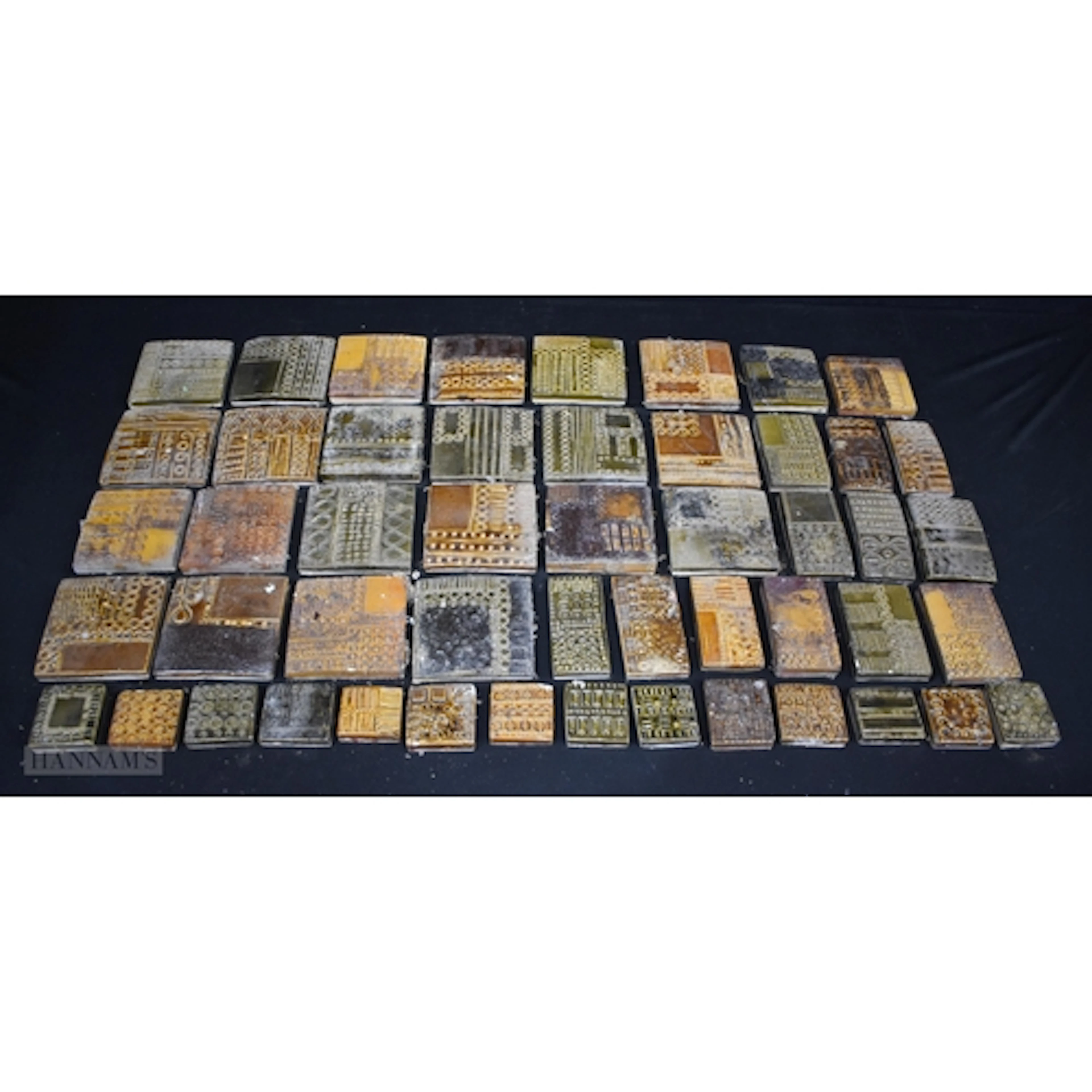 A collection of vintage ceramic tiles decorated with concent...