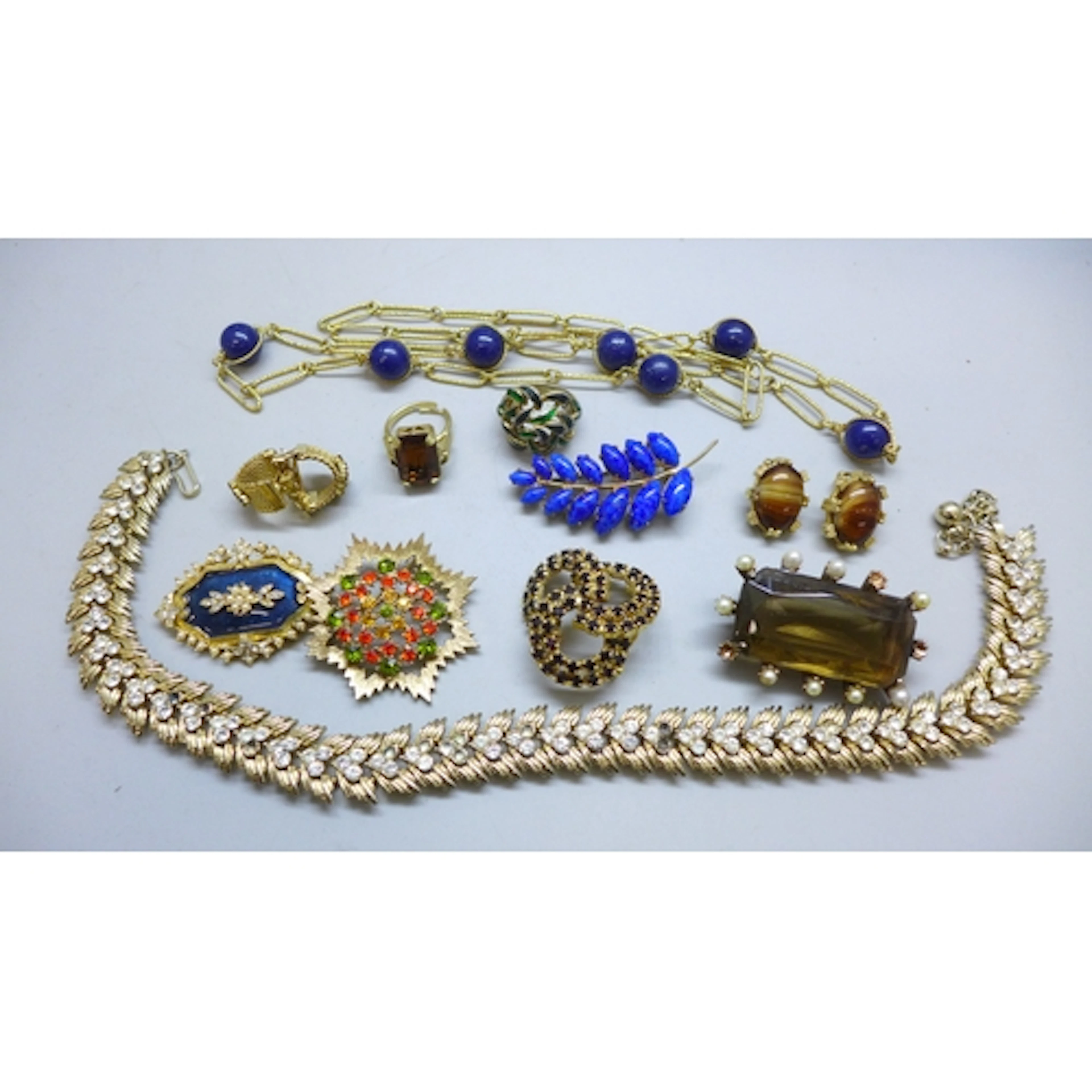 A collection of costume jewellery including a Trifari neckla...