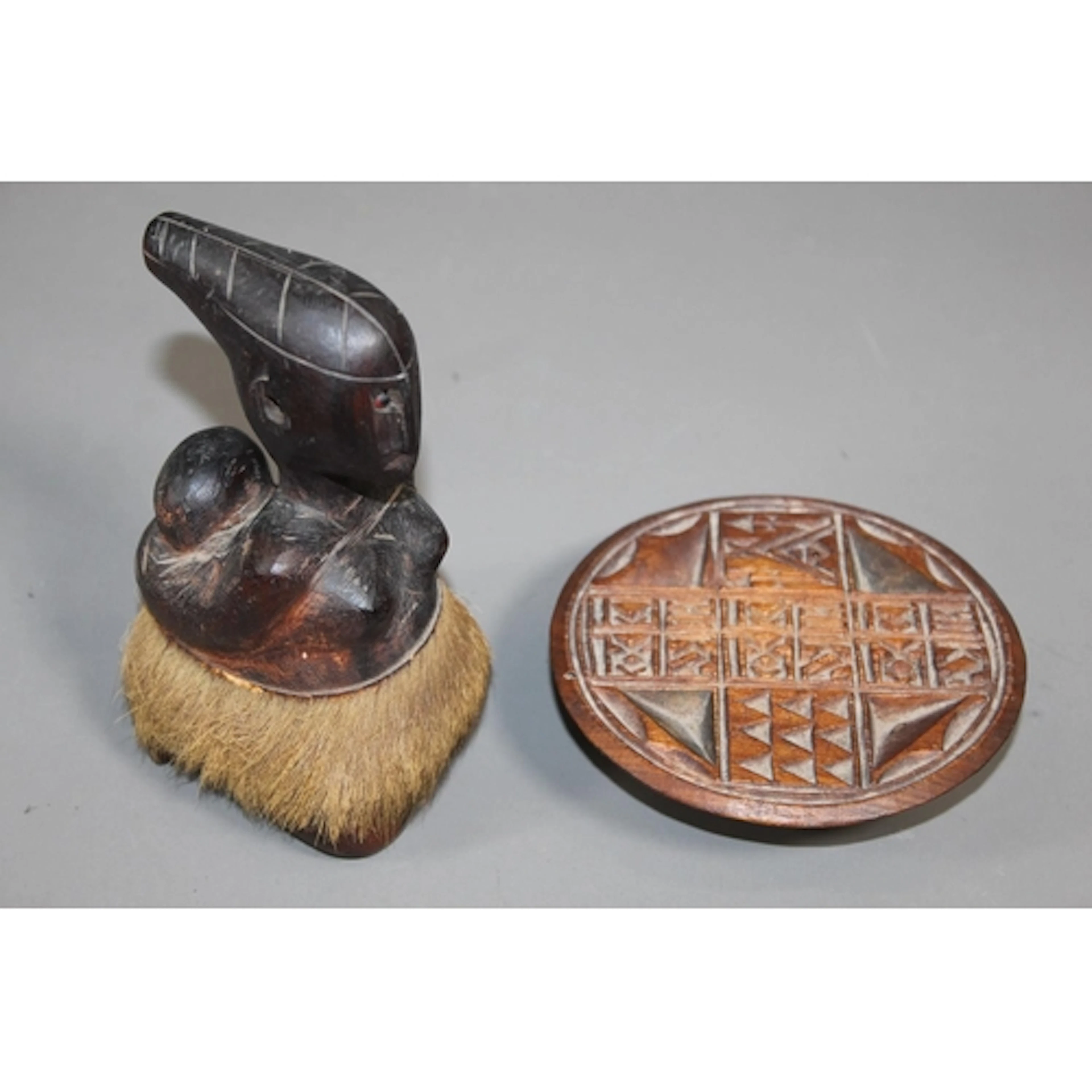 African tribal sculpture of a mother and child and a wooden ...
