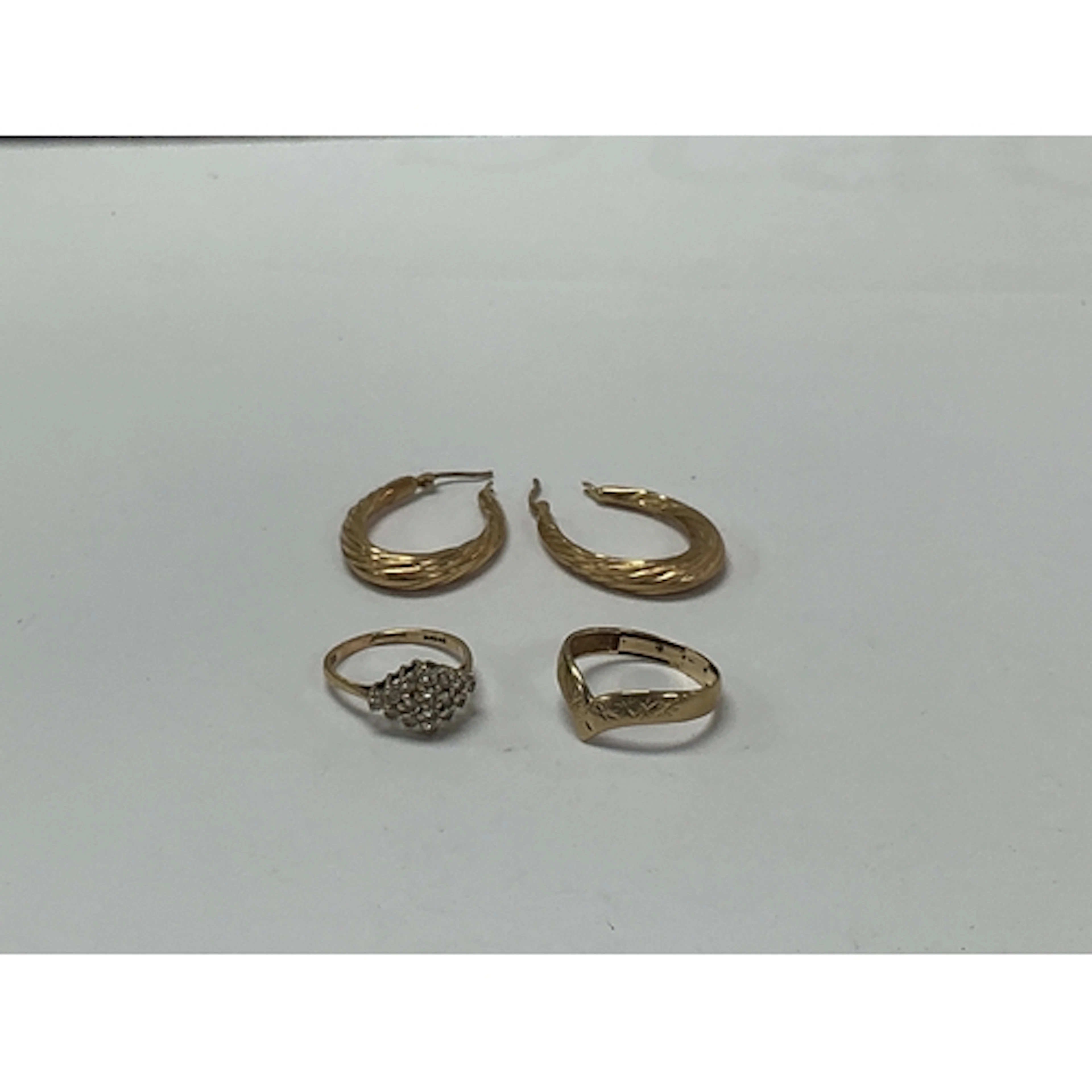 Two 9ct gold rings, one set with white chip stones, plus a p...