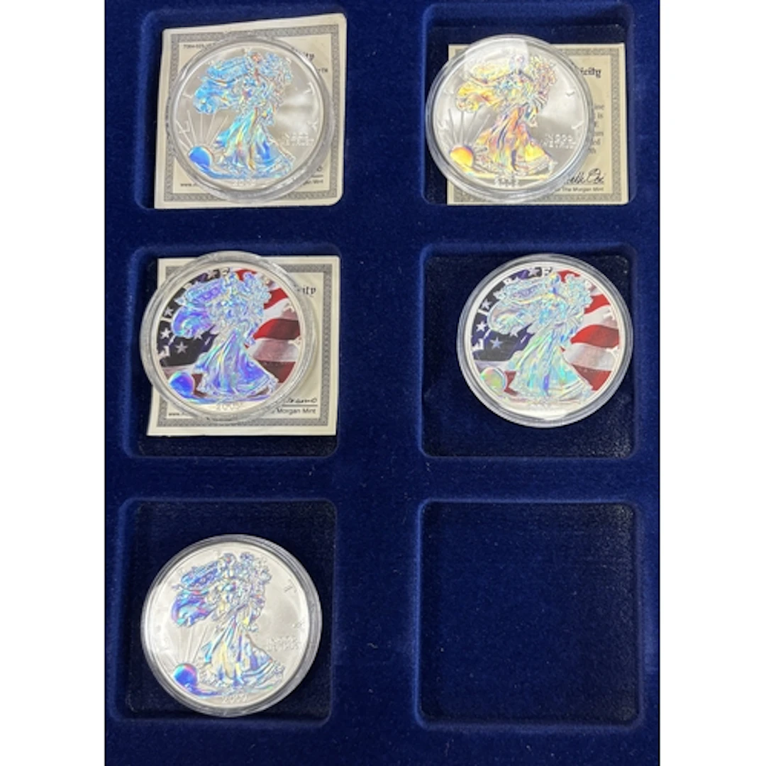 USA. Range of uncirculated Walking Liberty silver dollars, i...