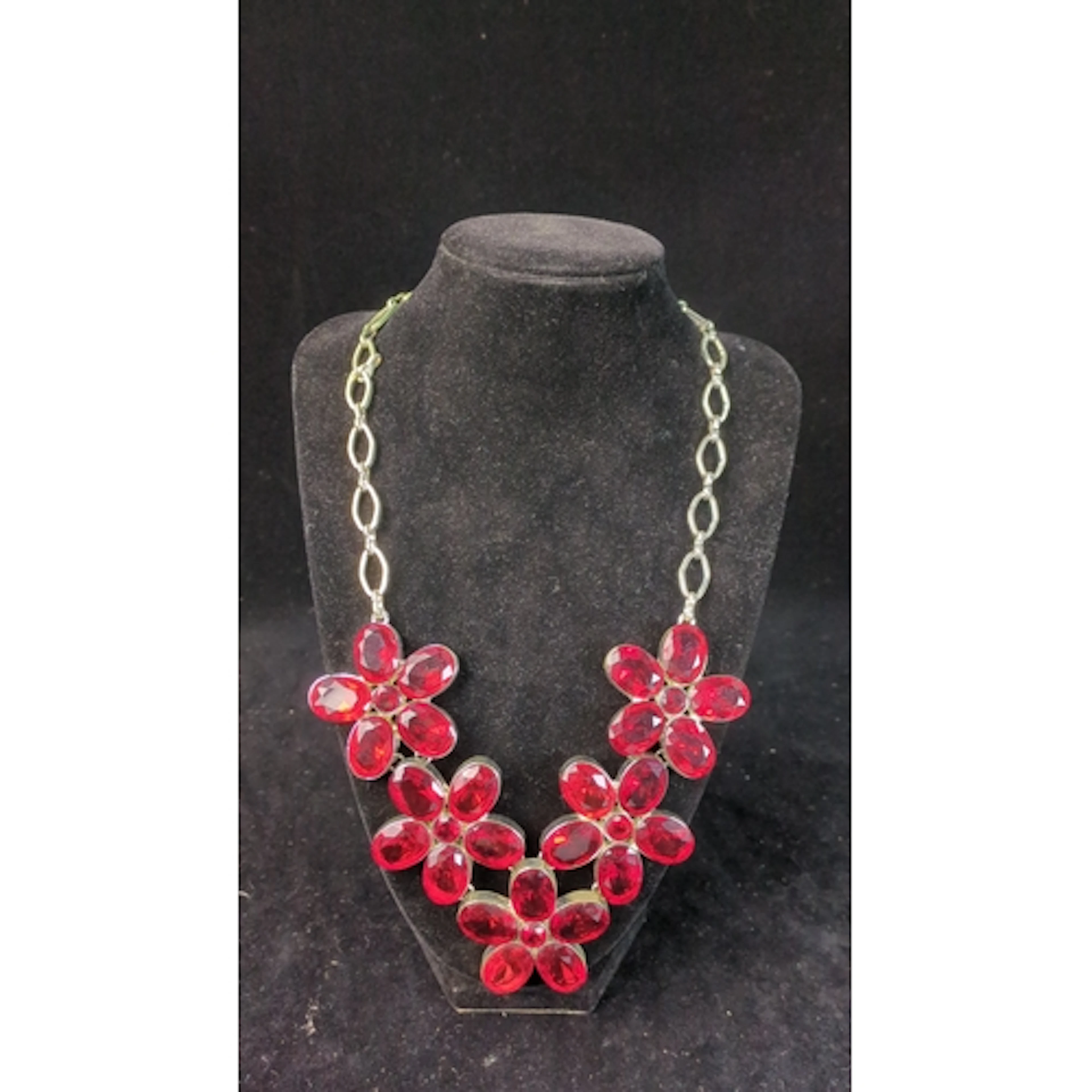 Silver-tone statement necklace composed of five linked flora...