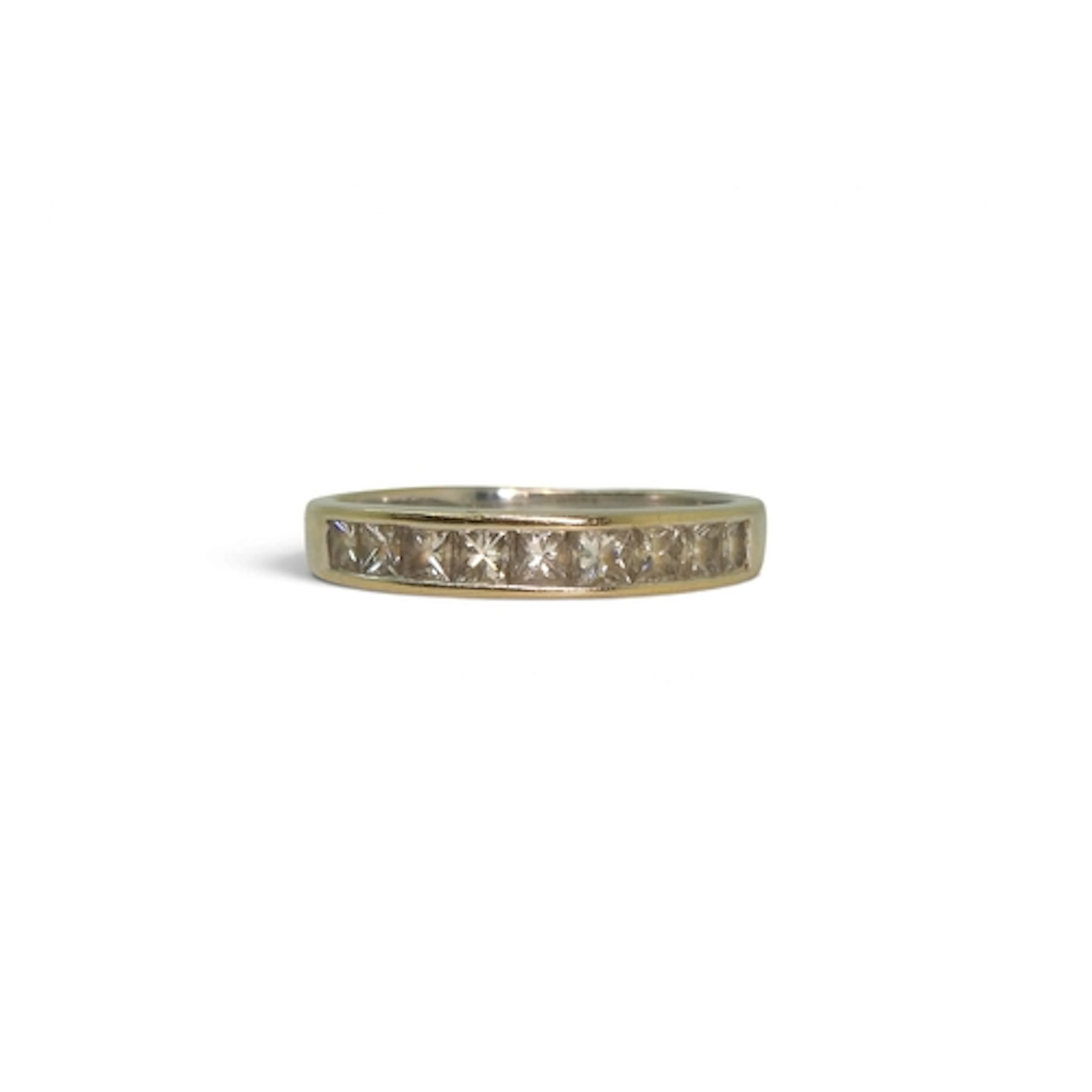 An 18ct white gold princess cut eternity ring, set with nine...
