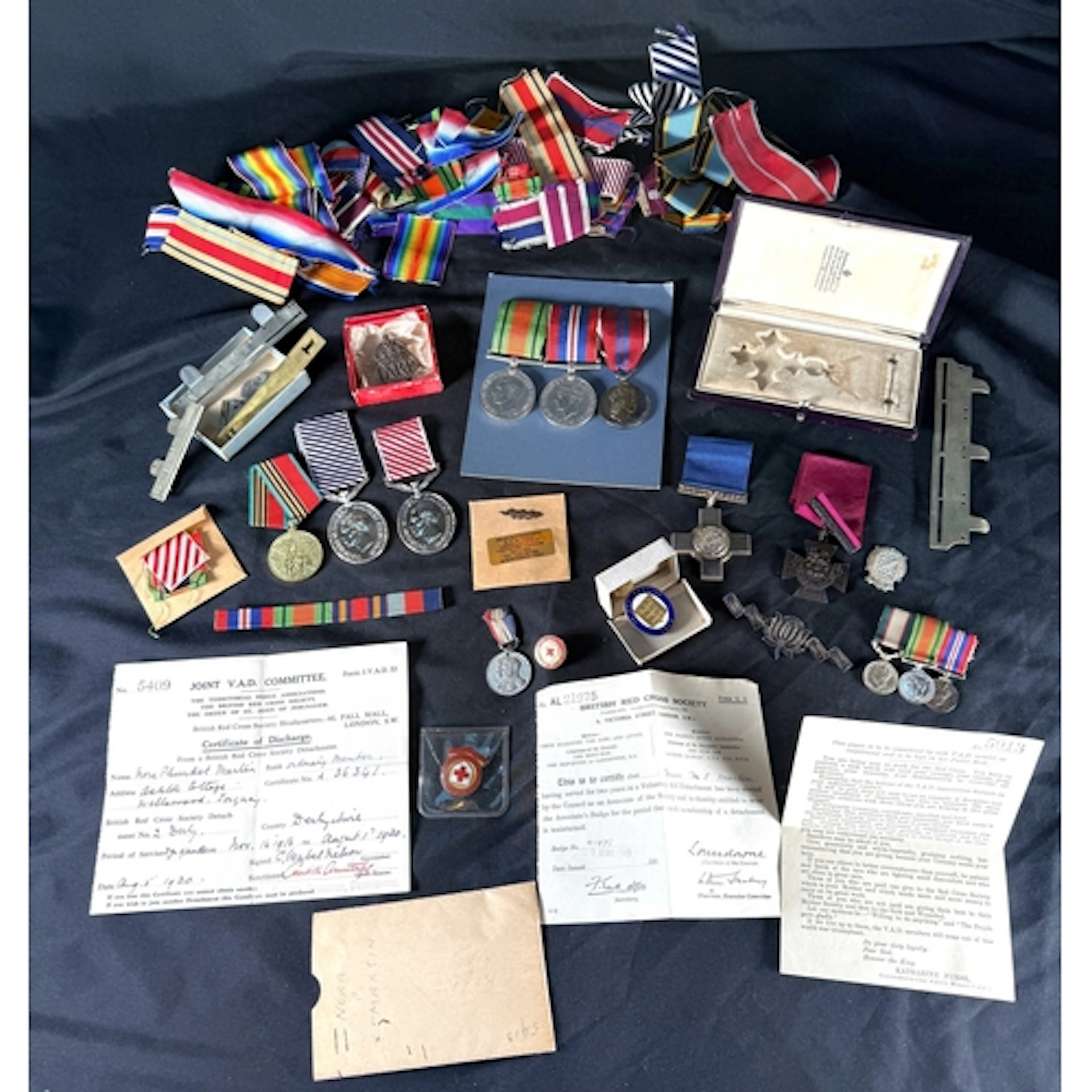 A collection of WWII medals, miniatures, ribbons, copy medal...