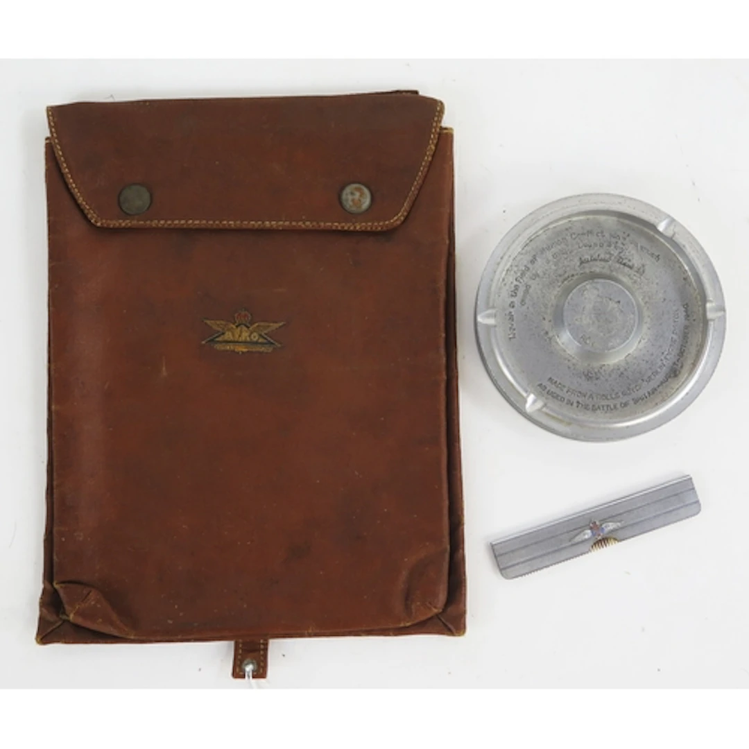 An Avro linen map holder with button down cover, an ashtray ...