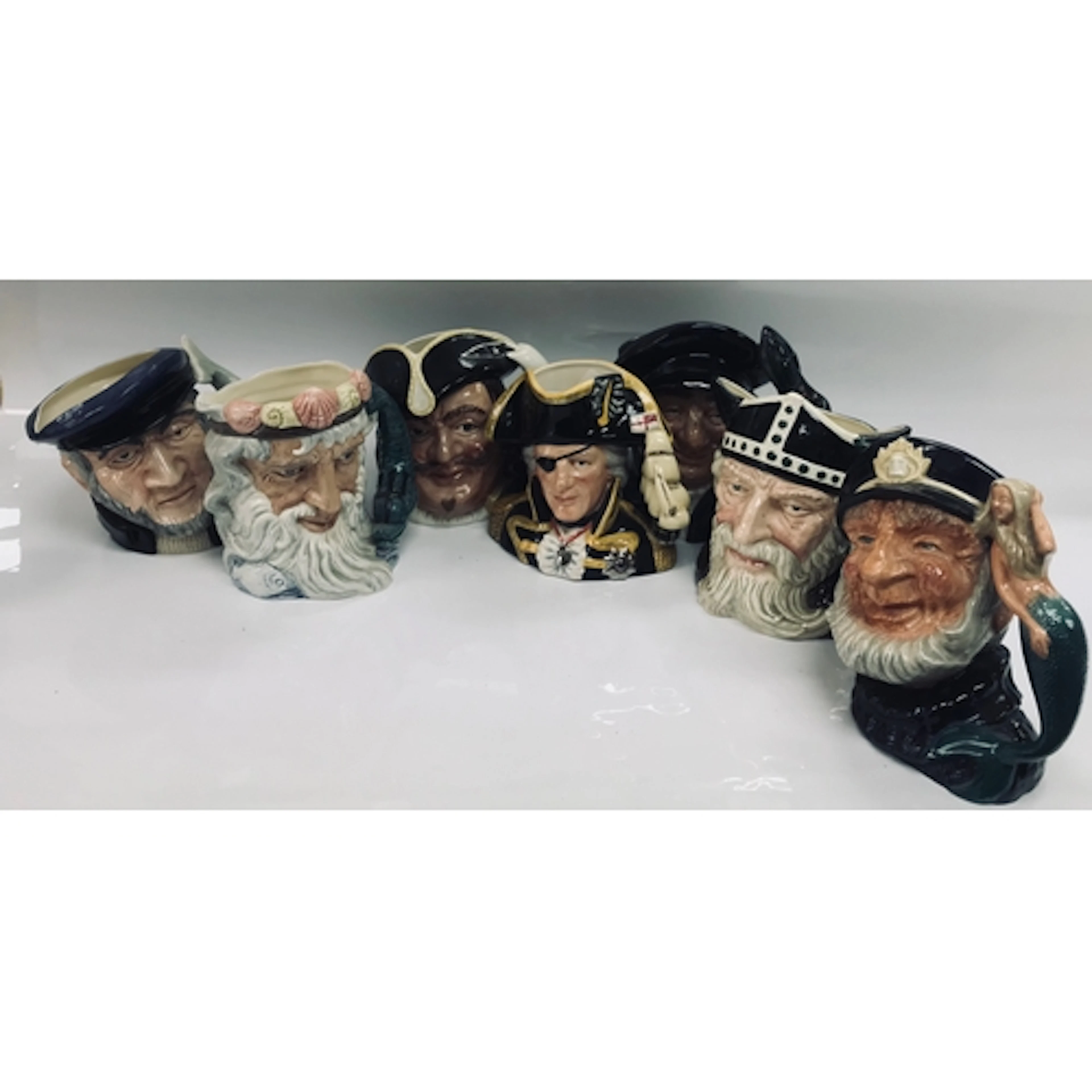 7 royal Doulton character jugs .Capt Ahab D 6500 .Nept...