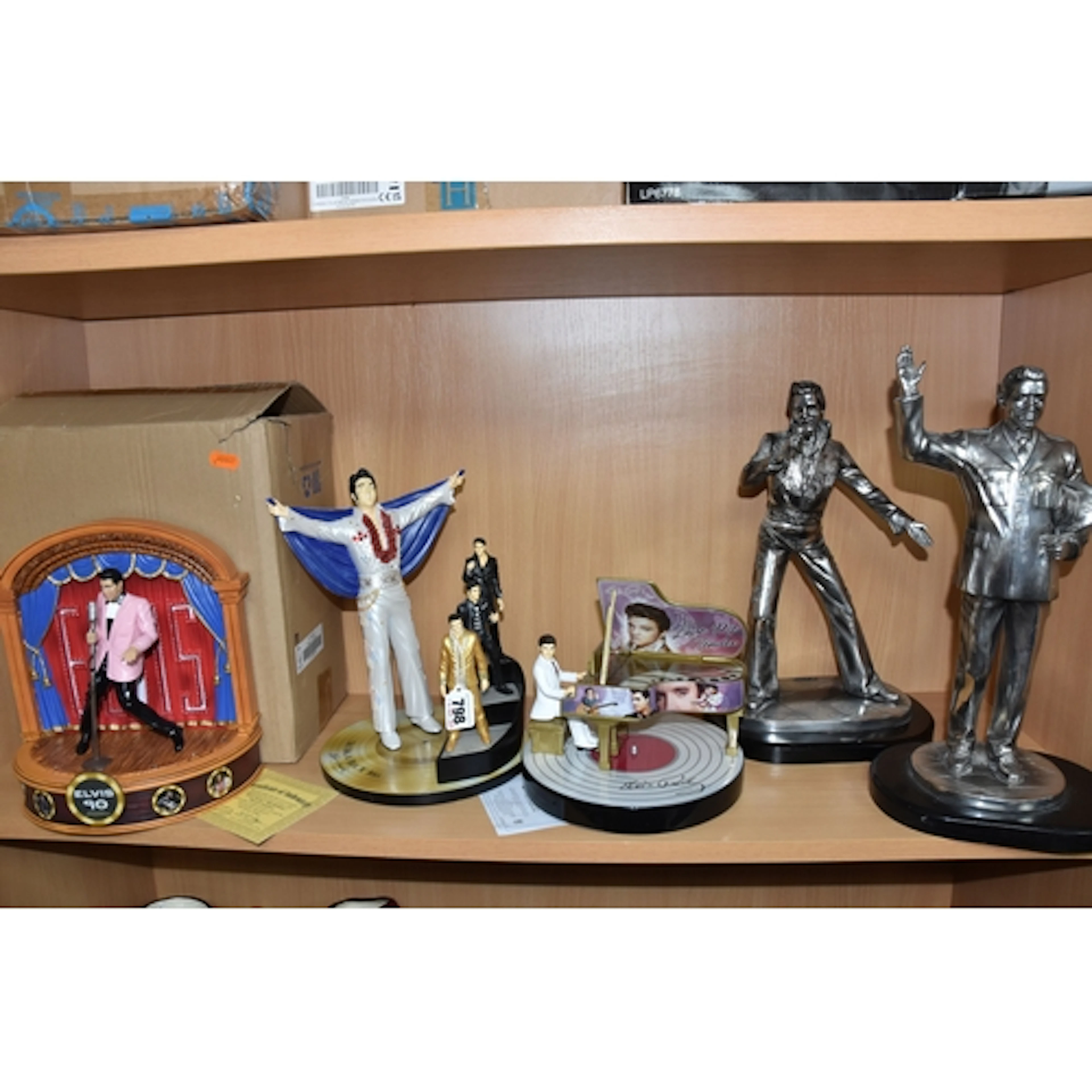 A GROUP OF ELVIS PRESLEY SCULPTURES, comprising two figures ...