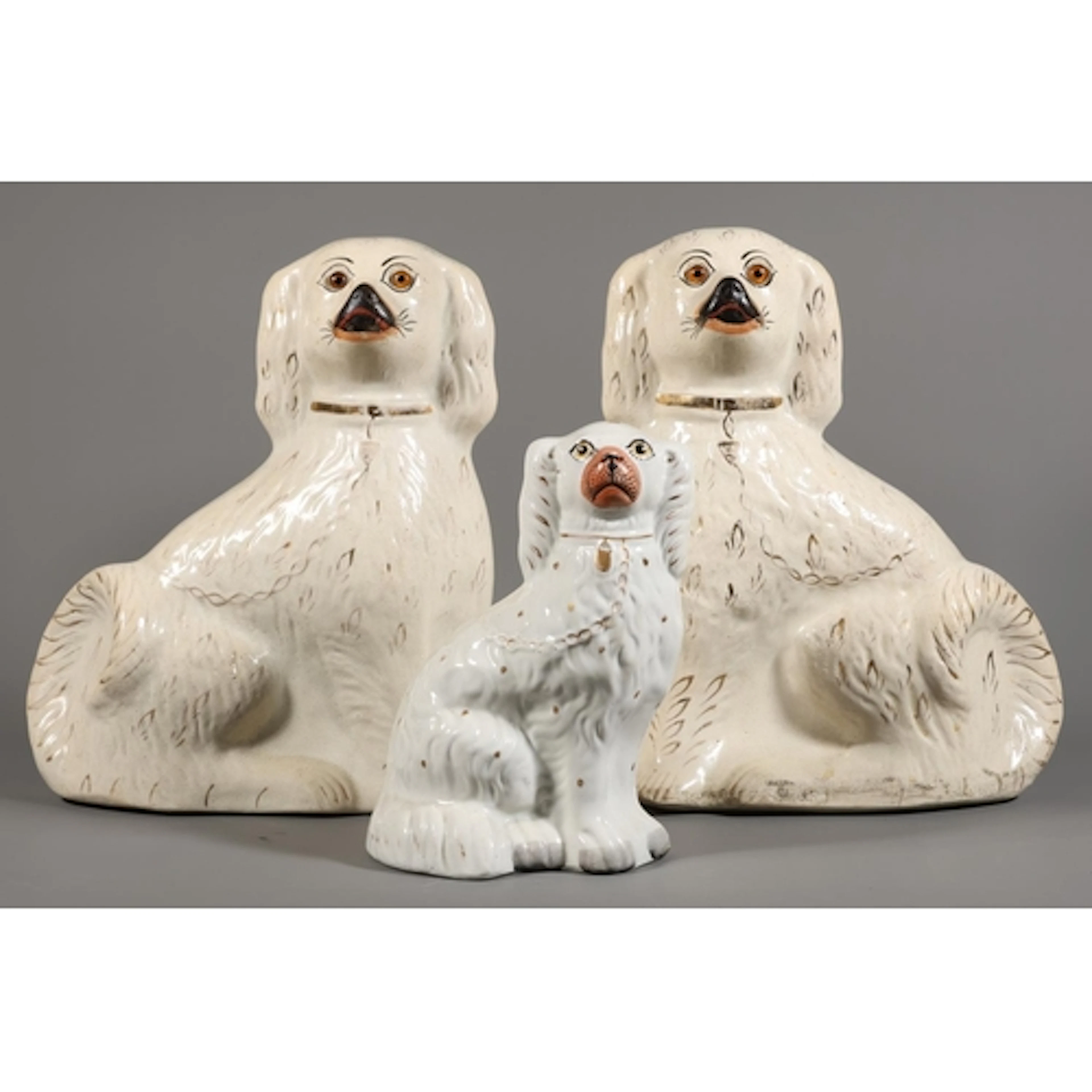 Pair of chimney spaniels, and another. (3)