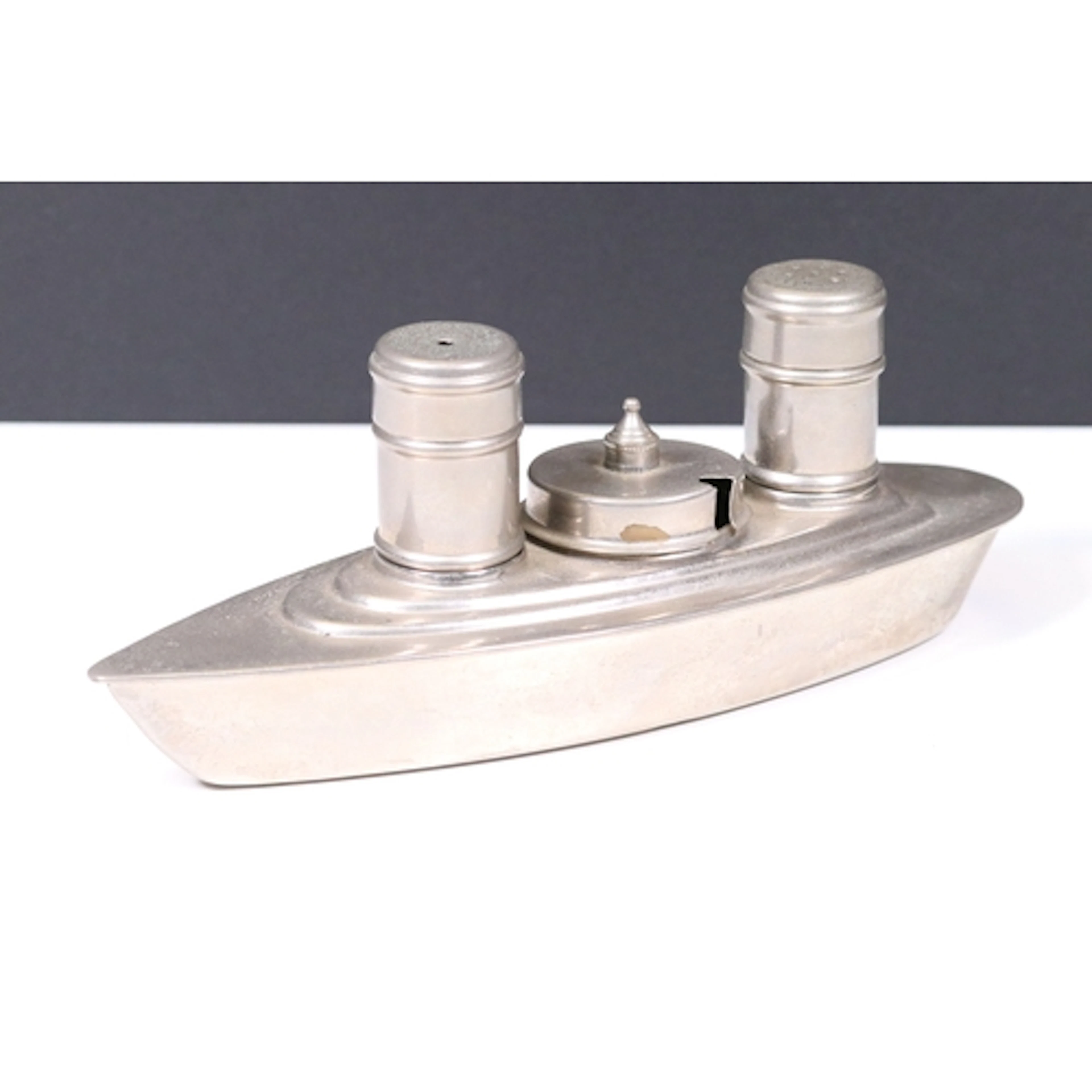 Art Deco style cruet set, in the form of a steam ship. Measu...