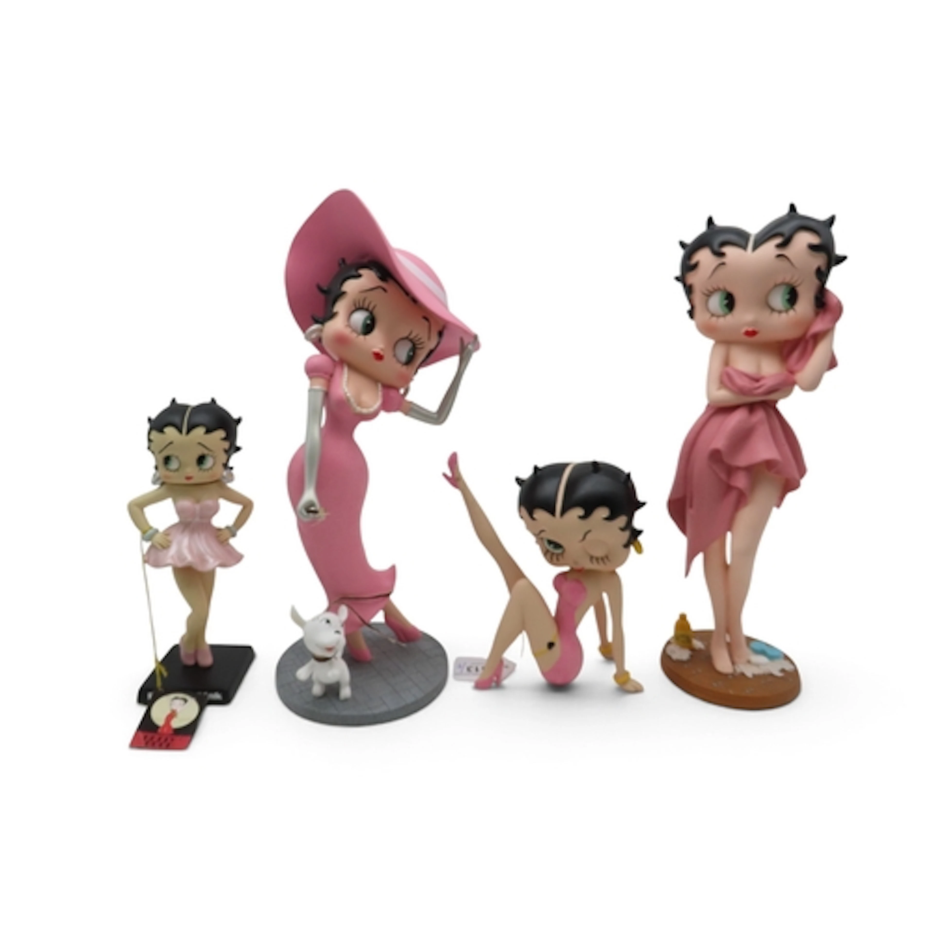 Four Betty Boop resin figures including Betty in pink walkin...