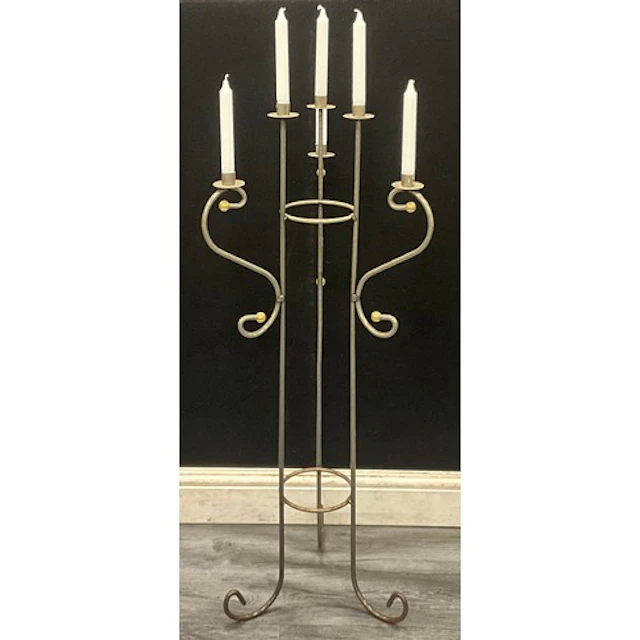 A floor standing six light three arm tubular iron candelabra...
