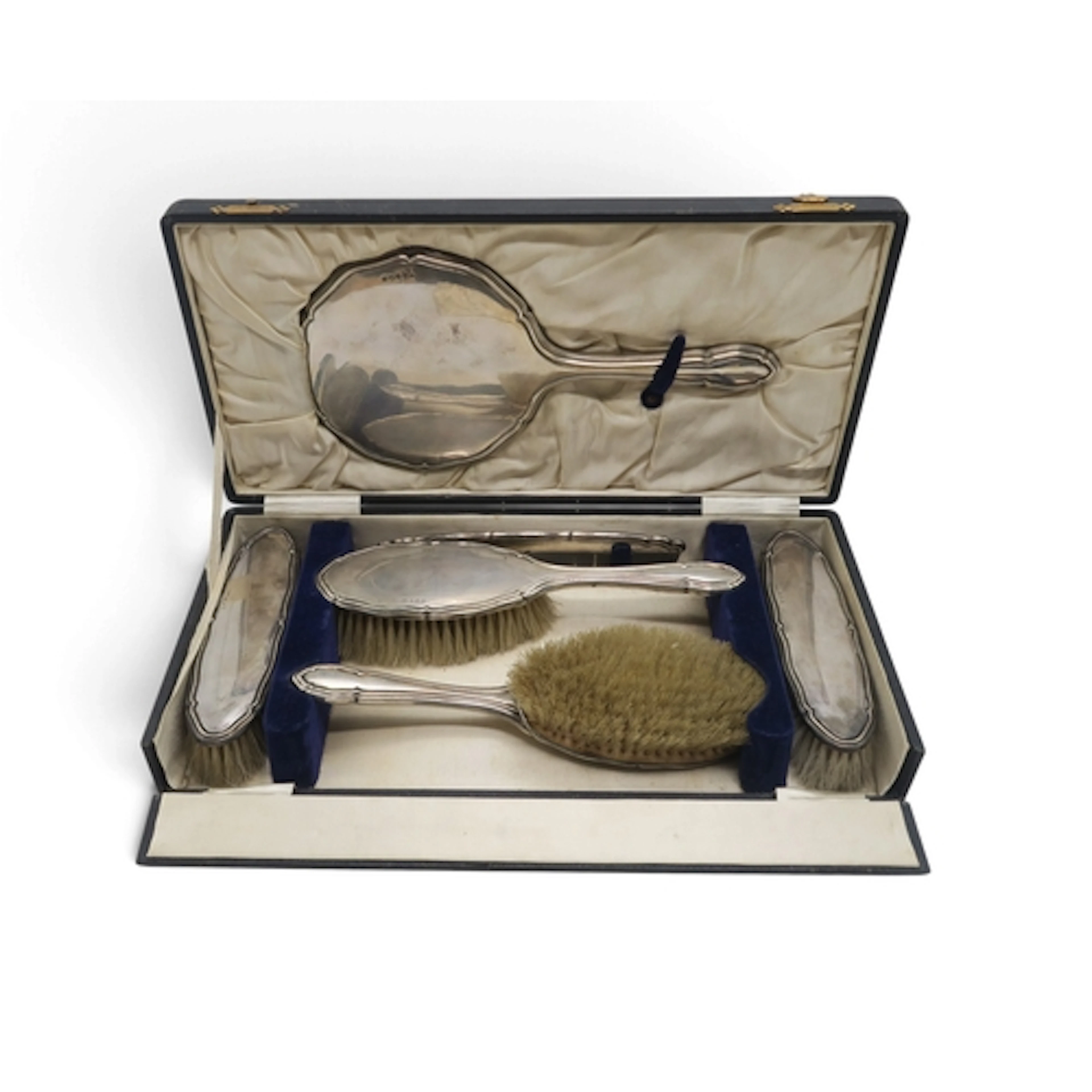 A cased George V silver-backed dressing set by T.M & Co....