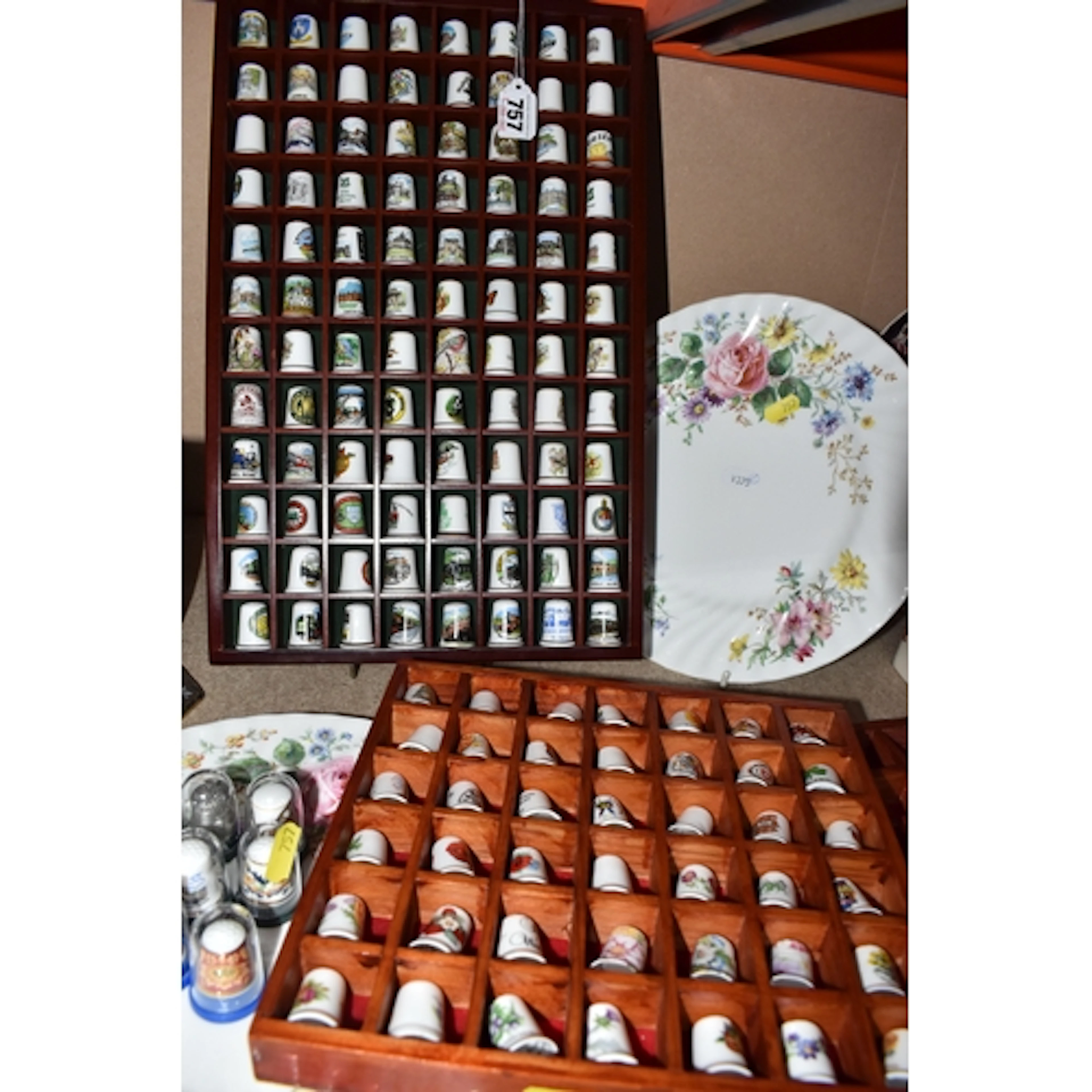 THREE DISPLAY RACKS OF CERAMIC THIMBLES AND TWO PLATES to in...