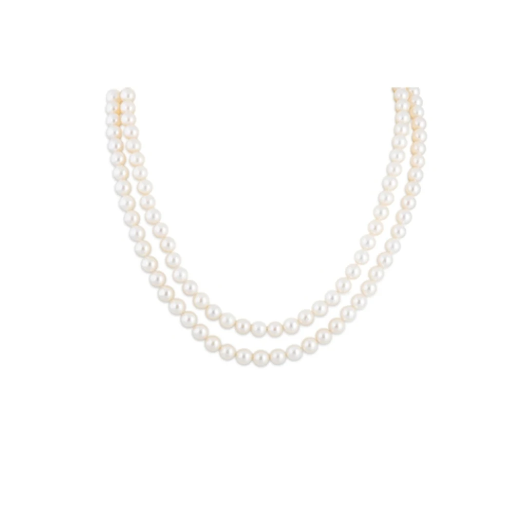 A TWO ROWED CULTURED PEARL NECKLACE, the uniform pearls to a...