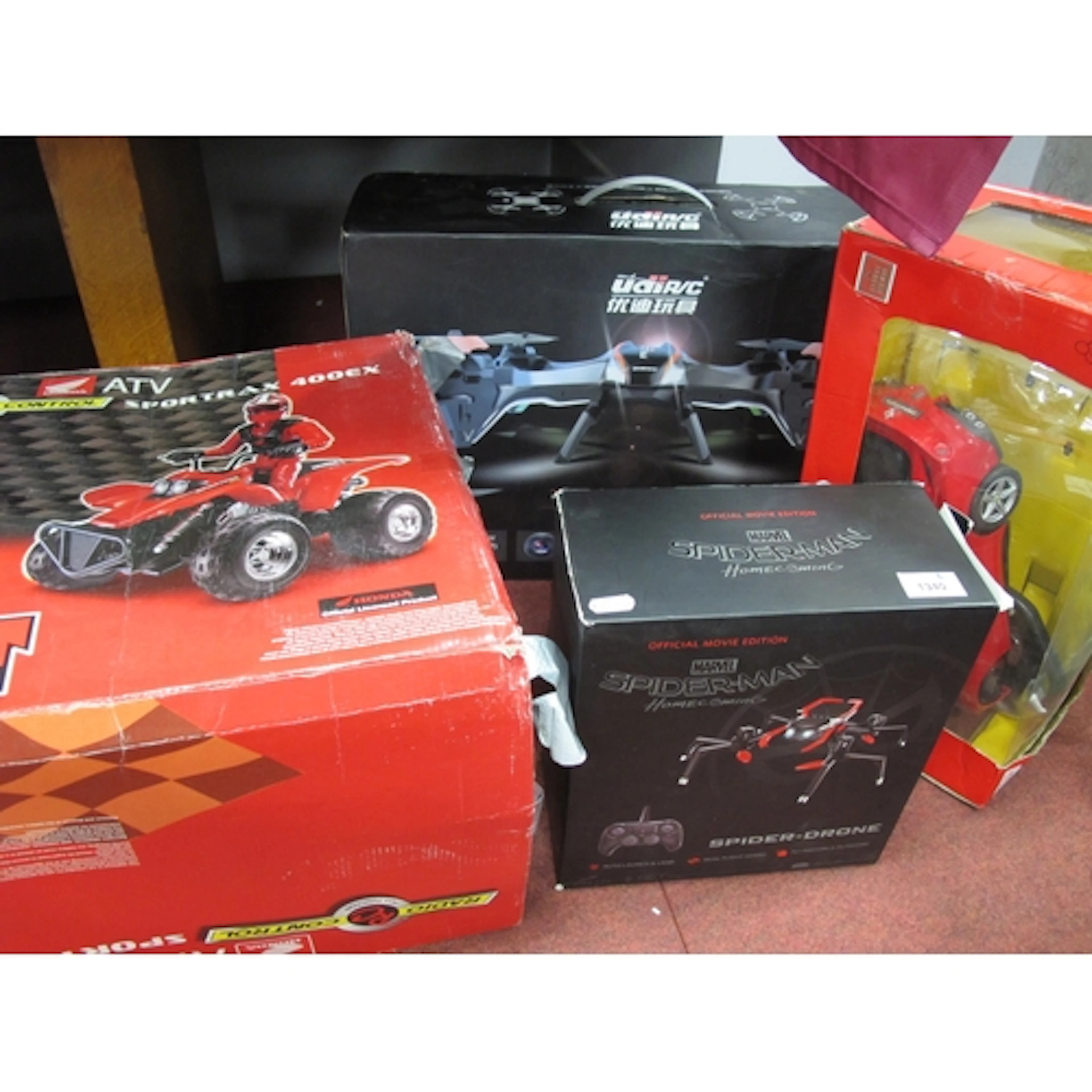Four boxed electronic toys, including Marvel Spider drone an...