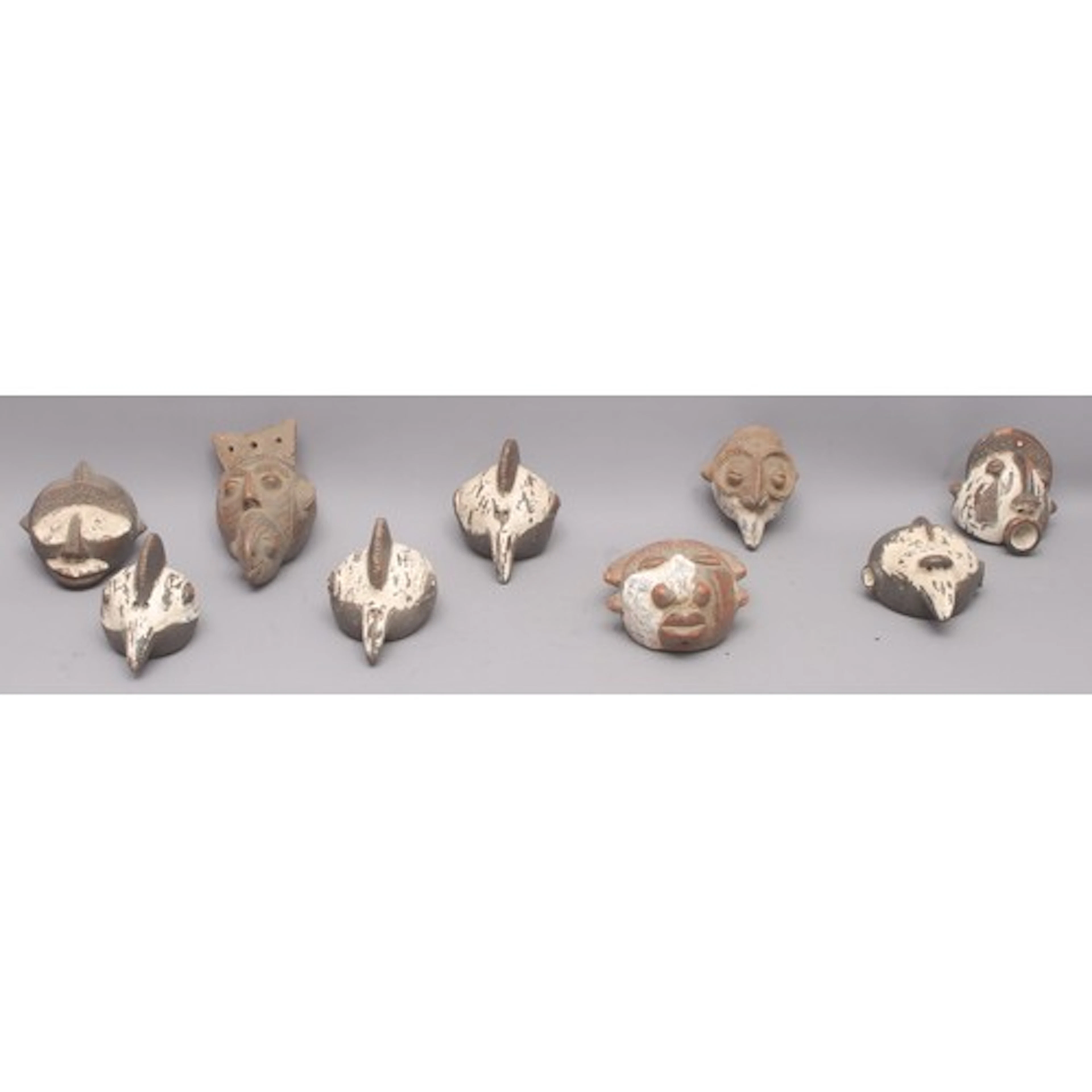 Tribal Art - a collection of nine African Tikar terracotta p...
