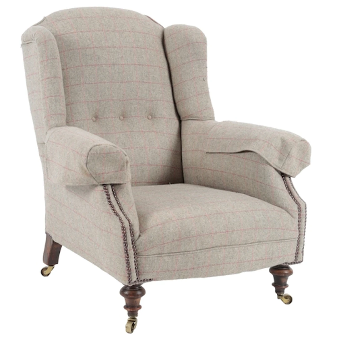 A late Victorian wing back armchair by Howard & Sons, circa ...