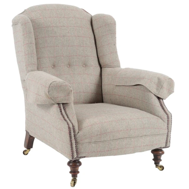 A late Victorian wing back armchair by Howard & Sons, circa ...