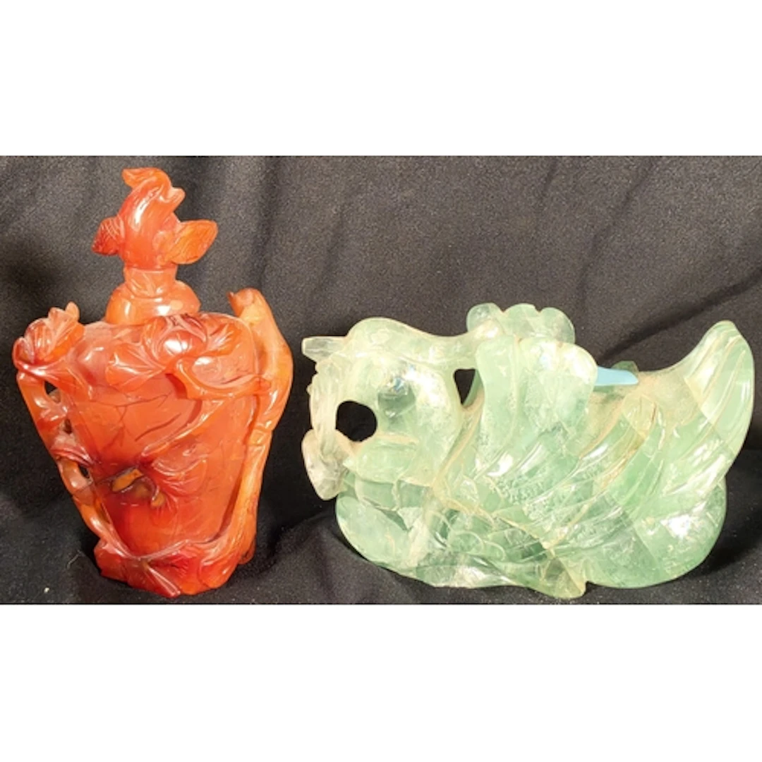 A Chinese carved agate lidded bottle with decoration of bran...