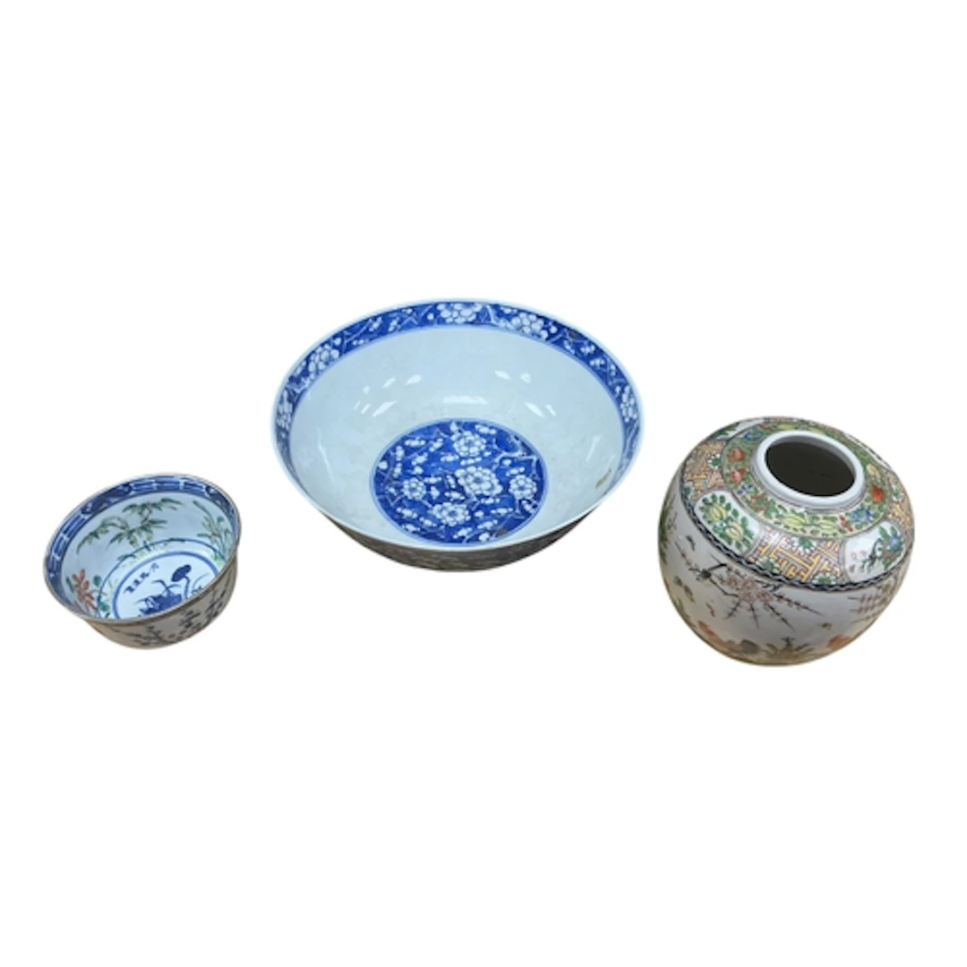 A Chinese blue and white prunus bowl, a rice grain bowl and ...