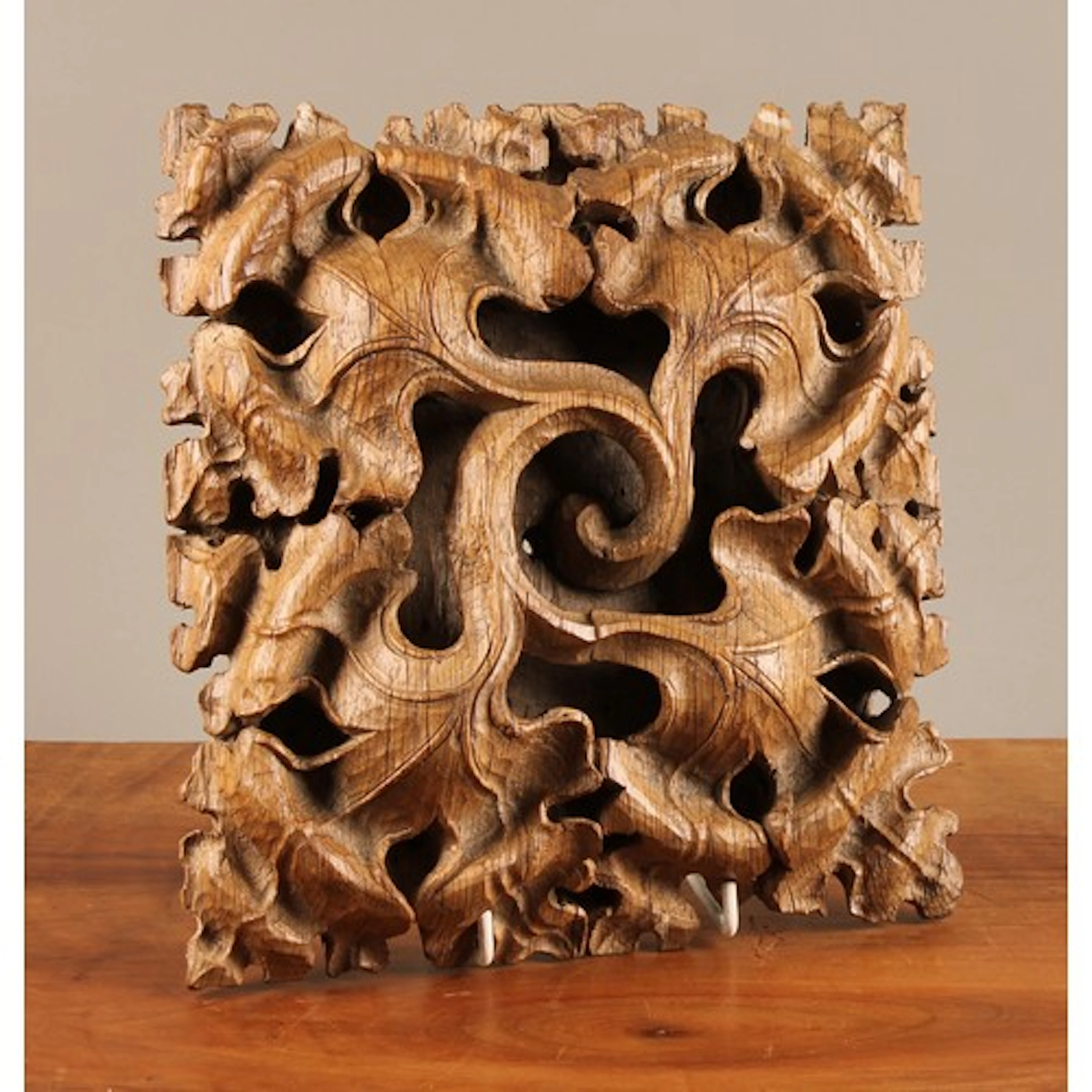 A Tudor Gothic oak roof boss, carved in high relief with nat...