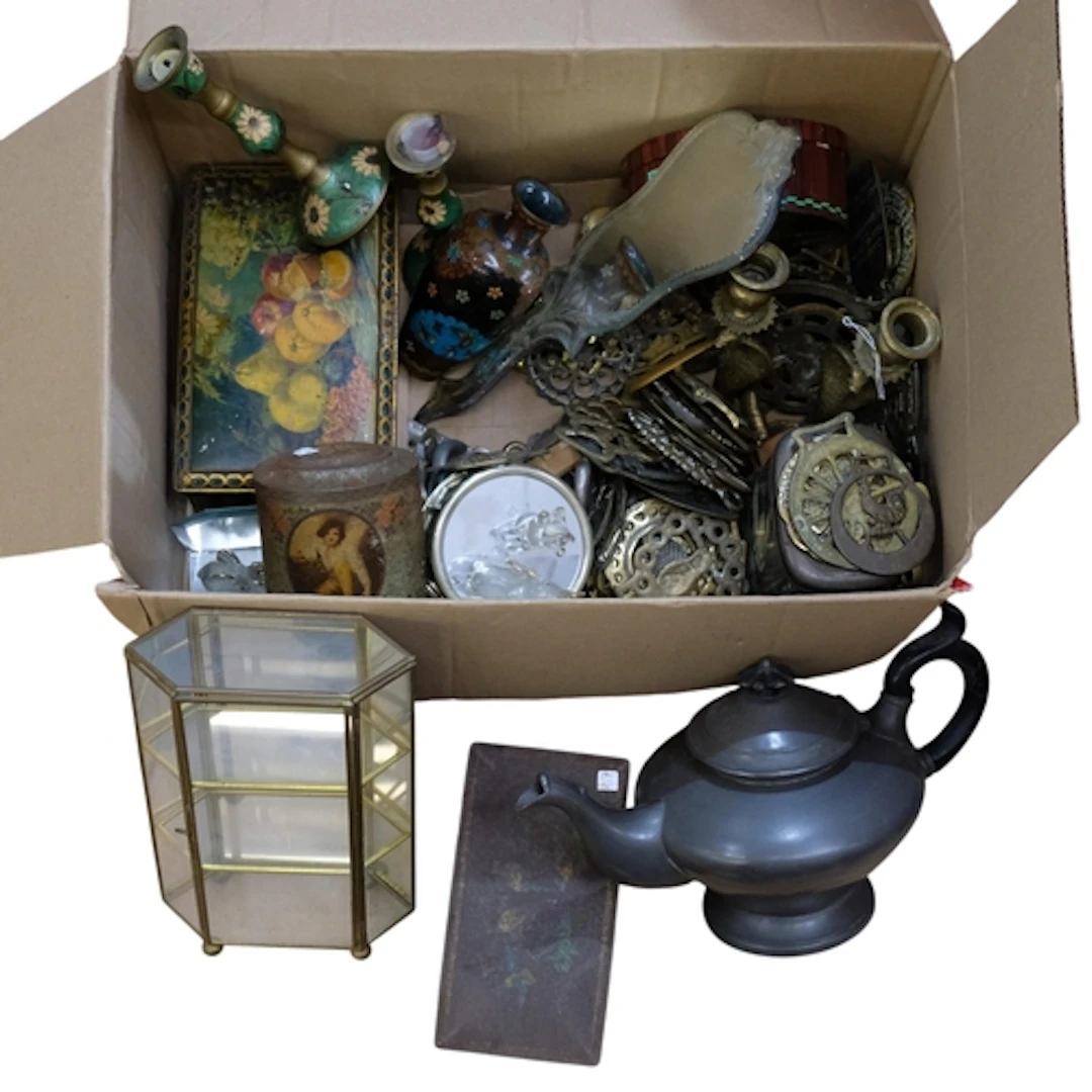 A boxful of tins, candlesticks, horse brasses, miniature dis...