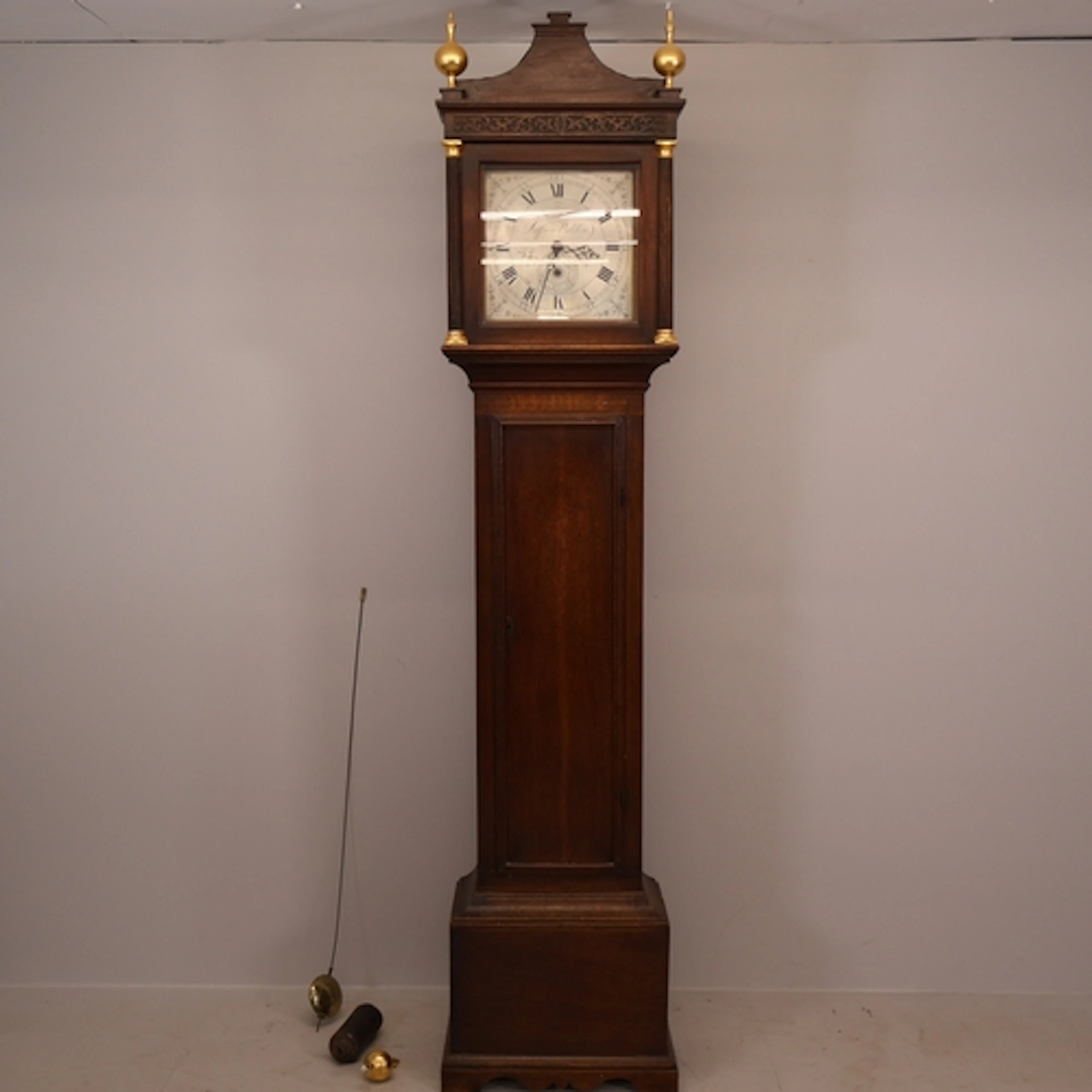A Victorian oak cased 30 hour long-case clock, the 11" brass...
