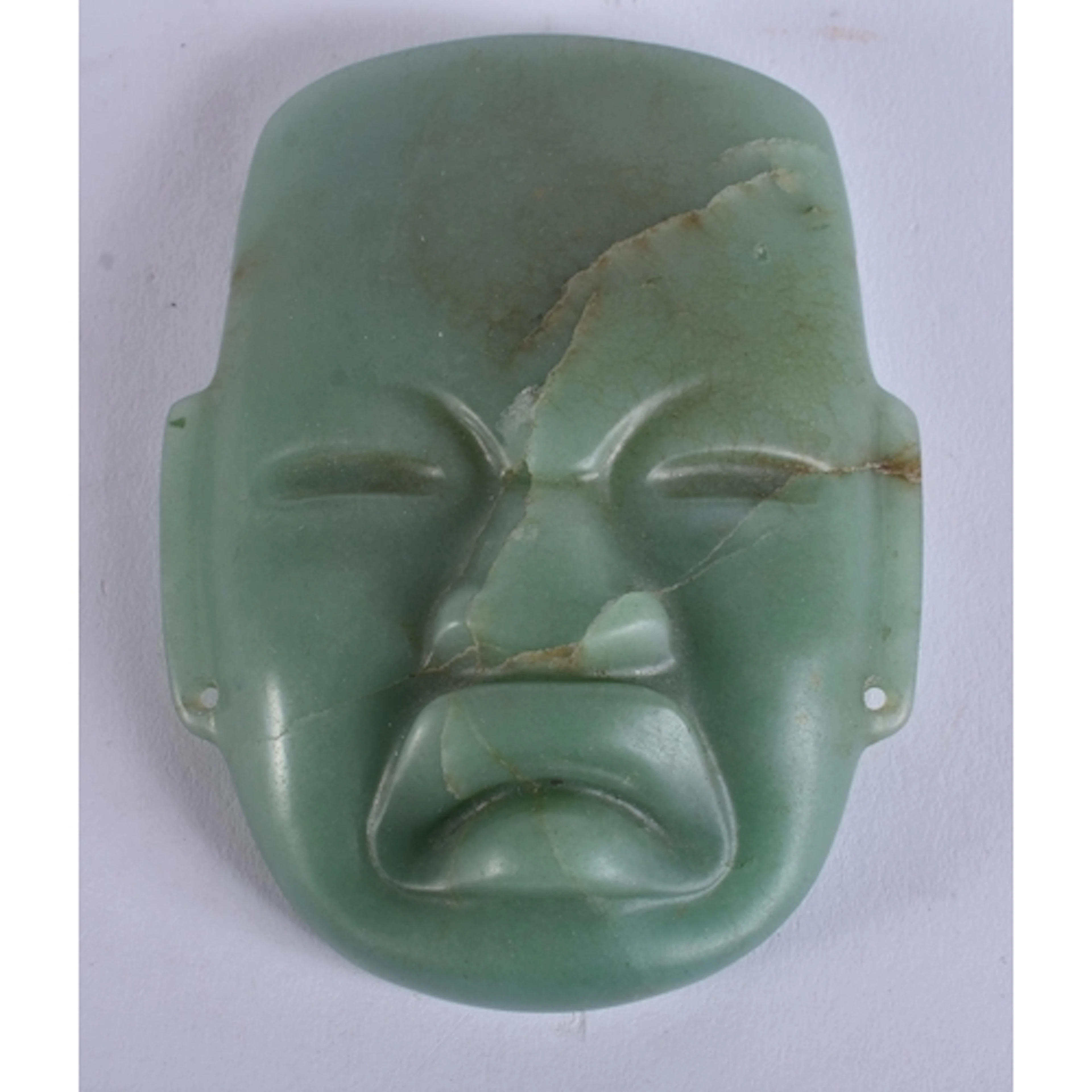 AN UNUSUAL SOUTH AMERICAN CARVED JADE OLMEC TRIBAL MASK. 9.5...