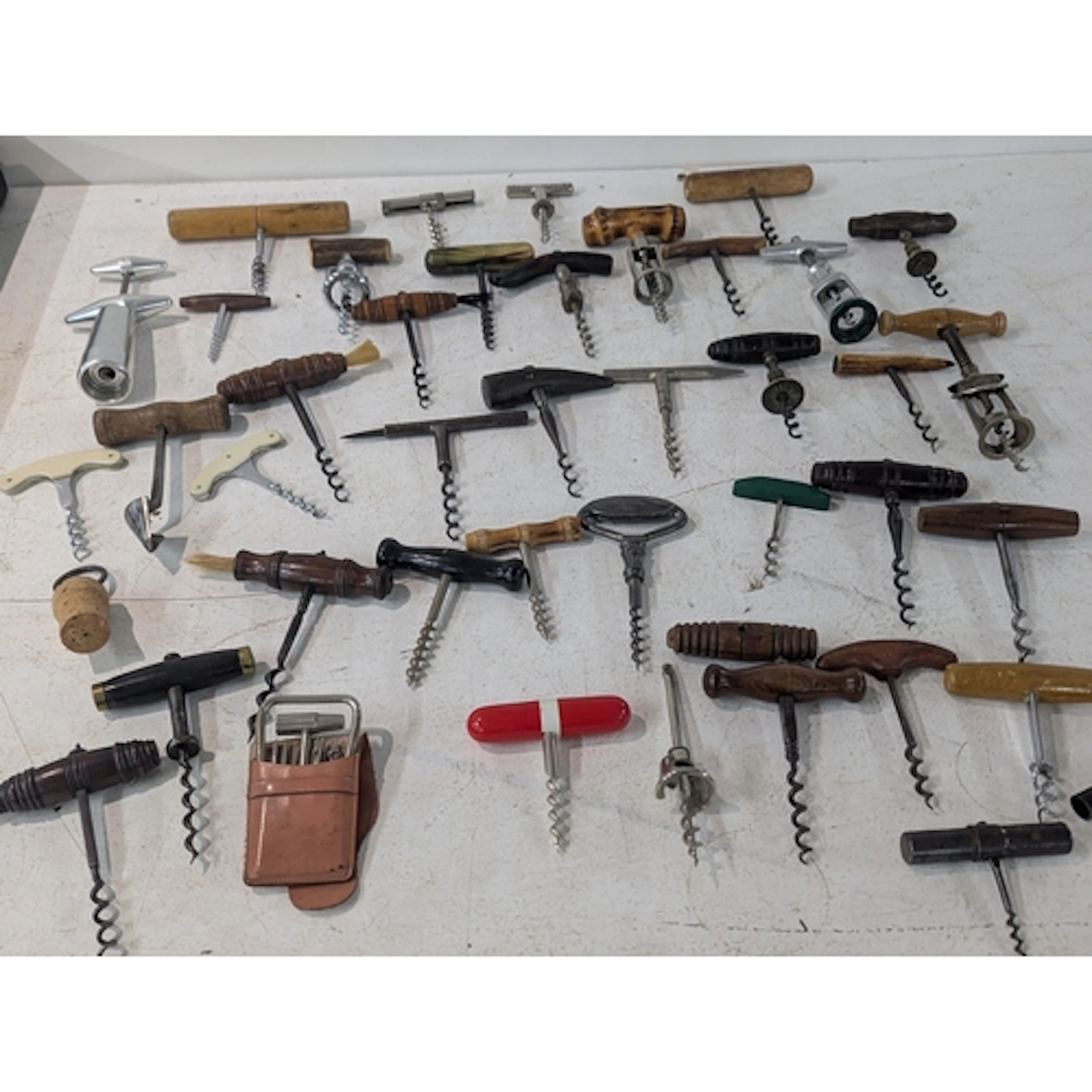 A collection of early to mid 20th century straight-pull cork...