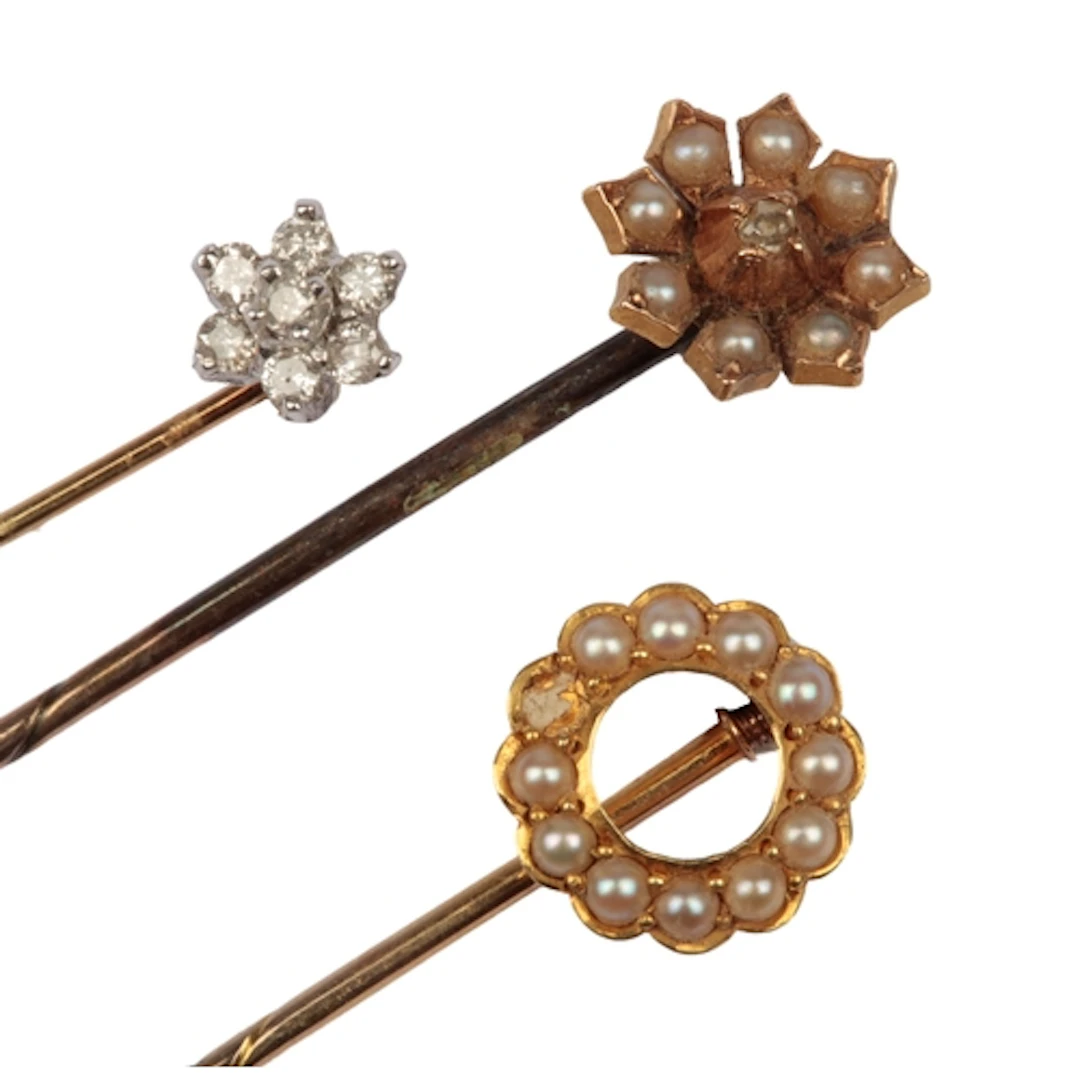 Three stick pins, early-mid 20th century, comprising: two Ed...