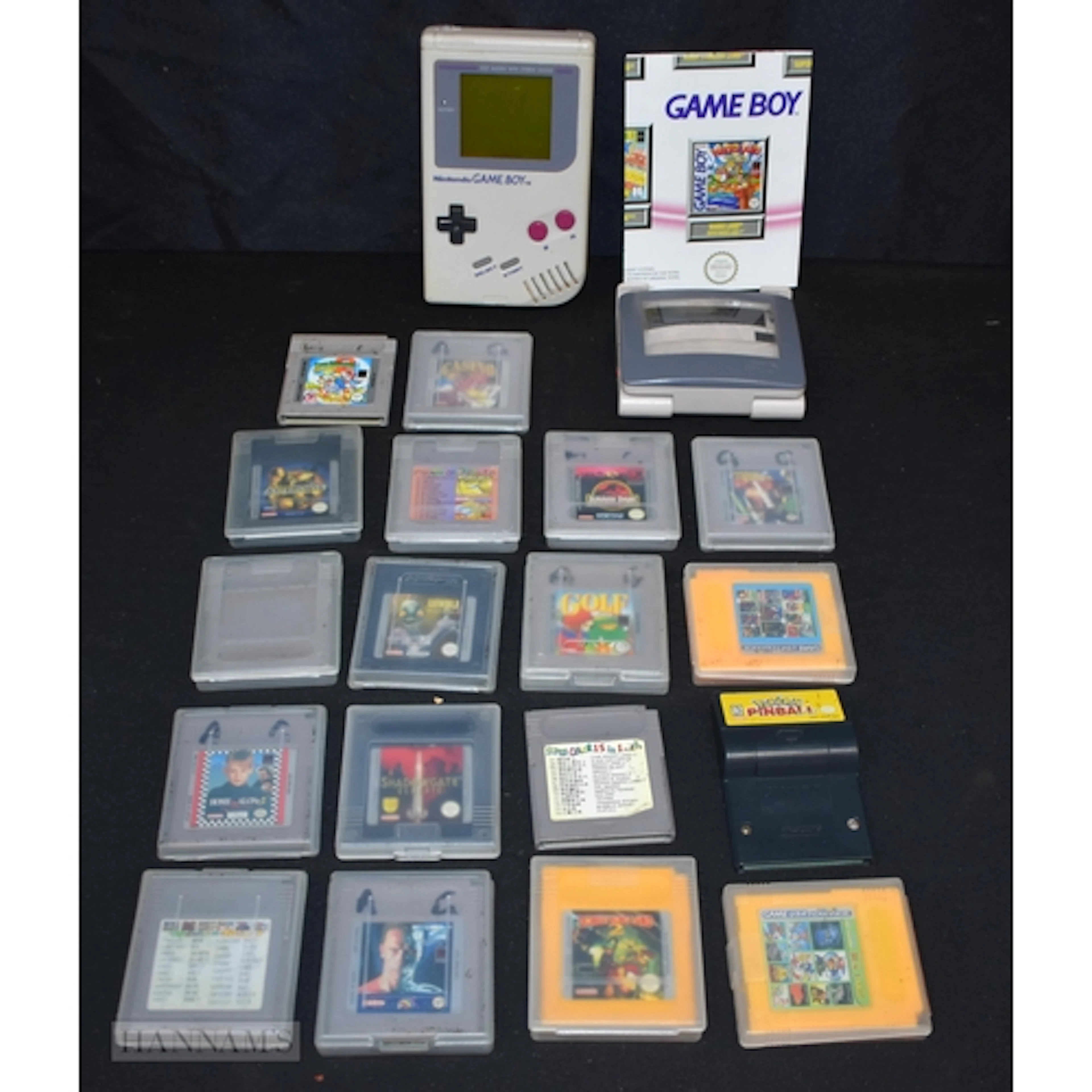 Nintendo game boy with a collection of games. (18)