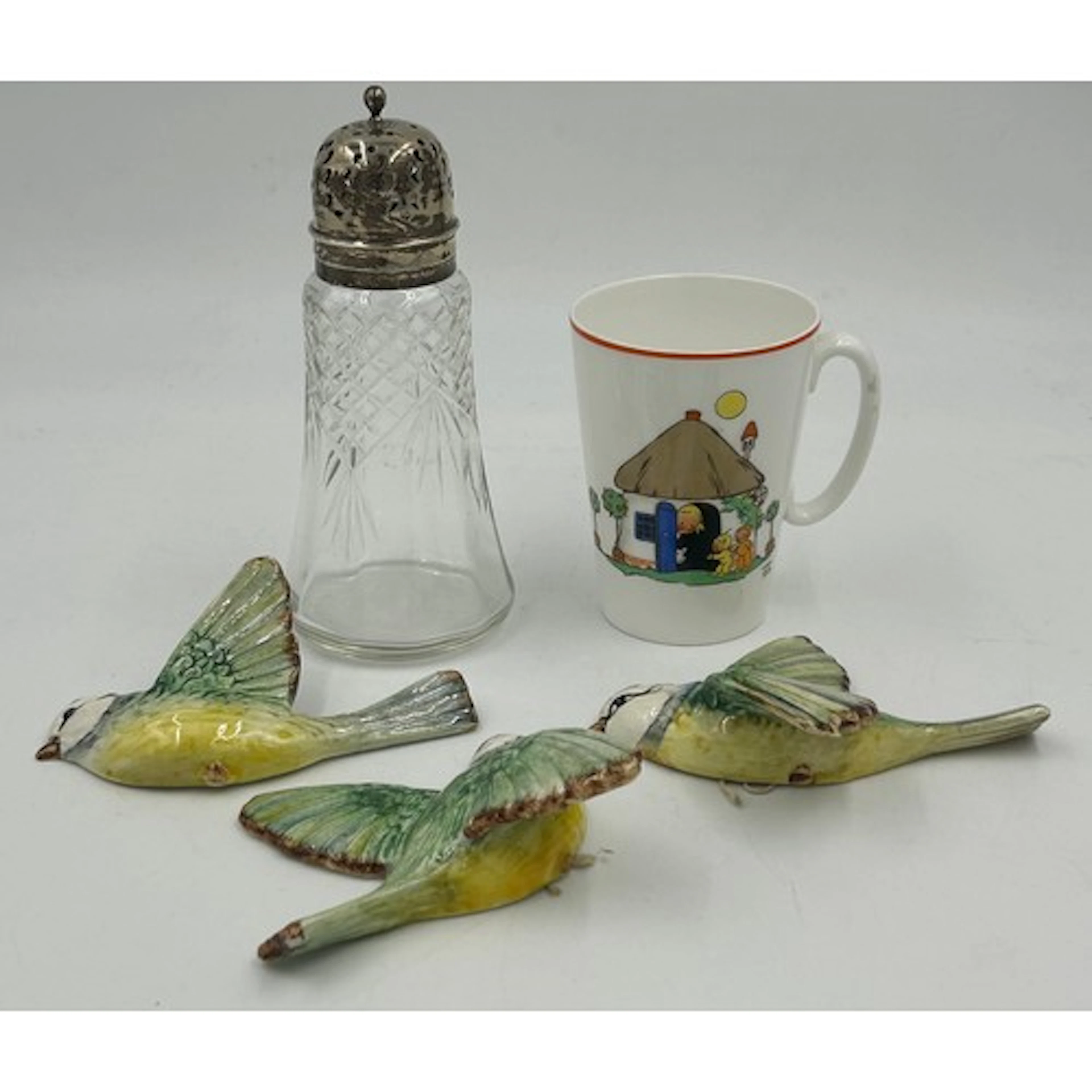 A set of three Beswick pottery wall mounted blue tits with b...