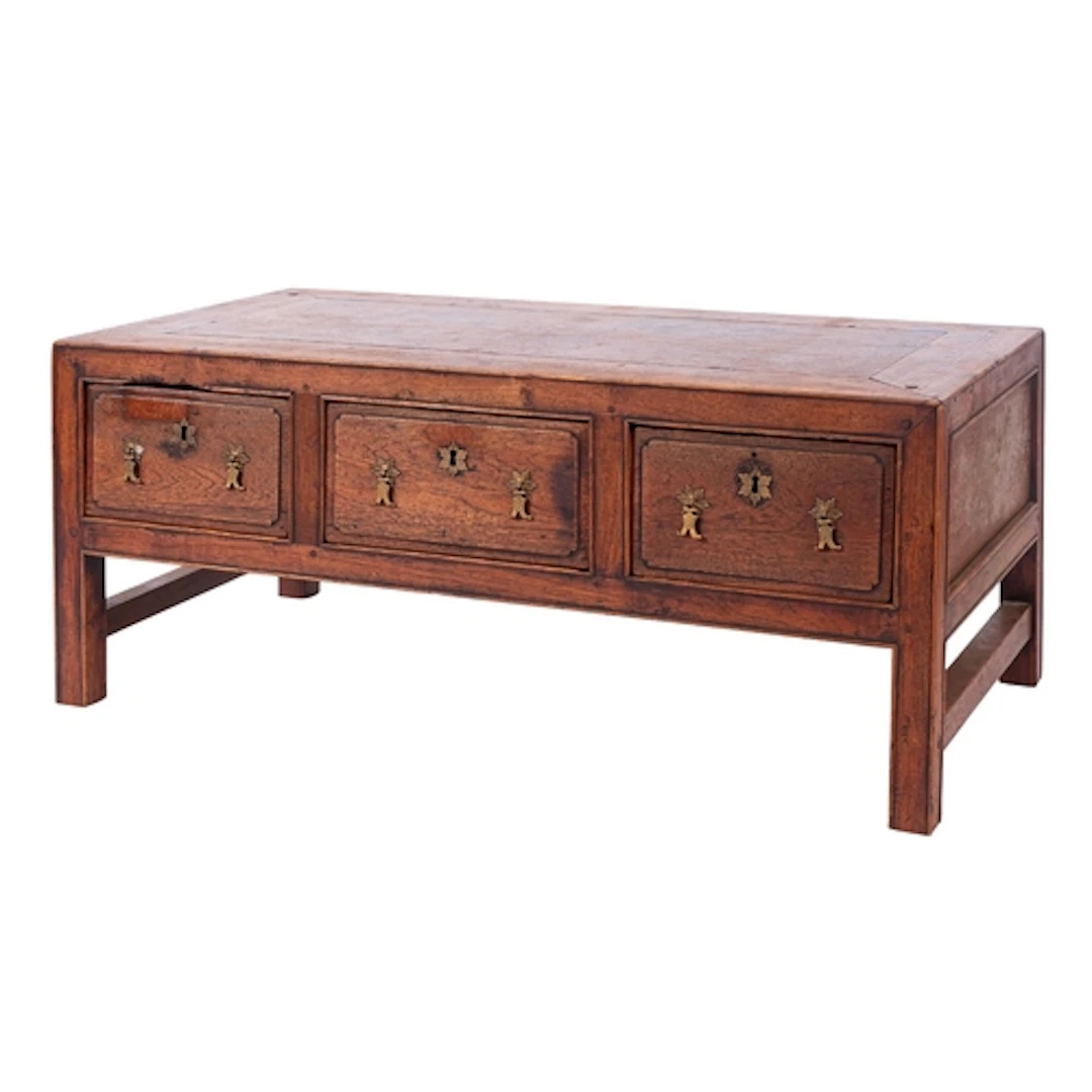 A Chinese hardwood low table, 20th century; with cleated top...