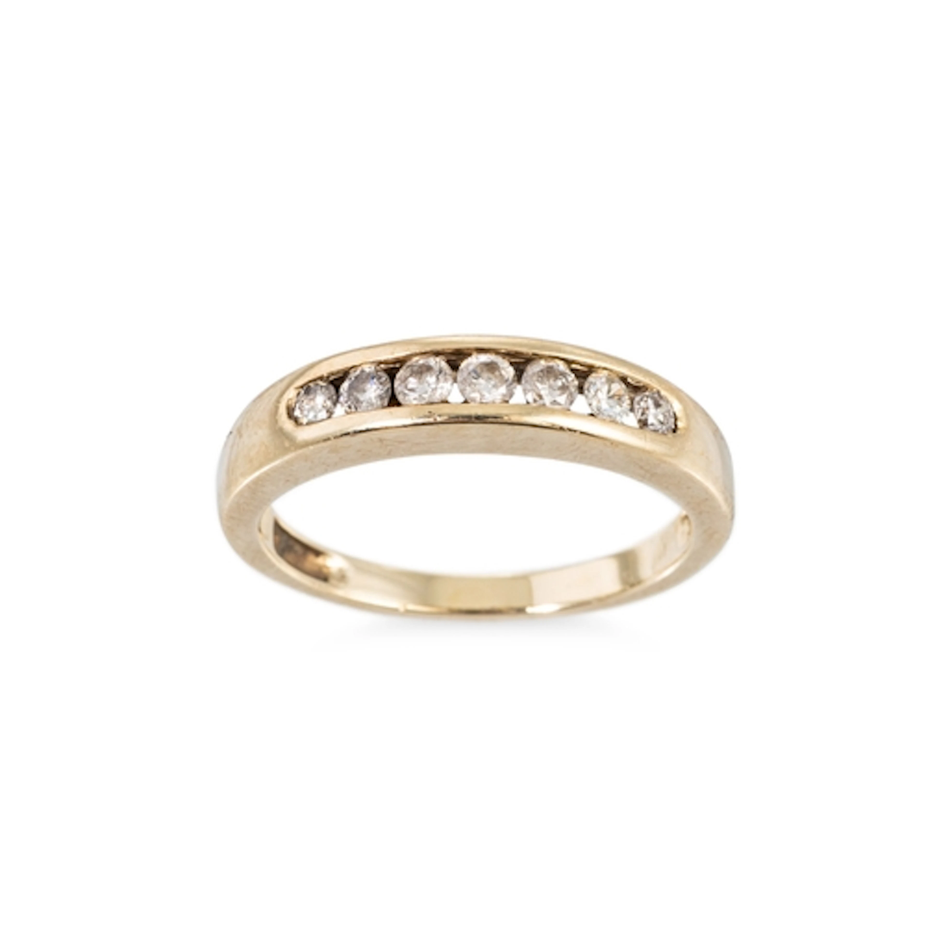 A DIAMOND HALF HOOP ETERNITY RING, the seven round brilliant...