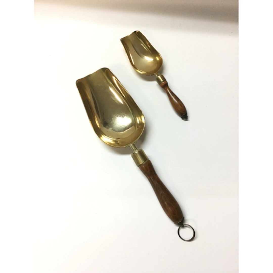 2 vintage brass scoops with a turned wooden handle