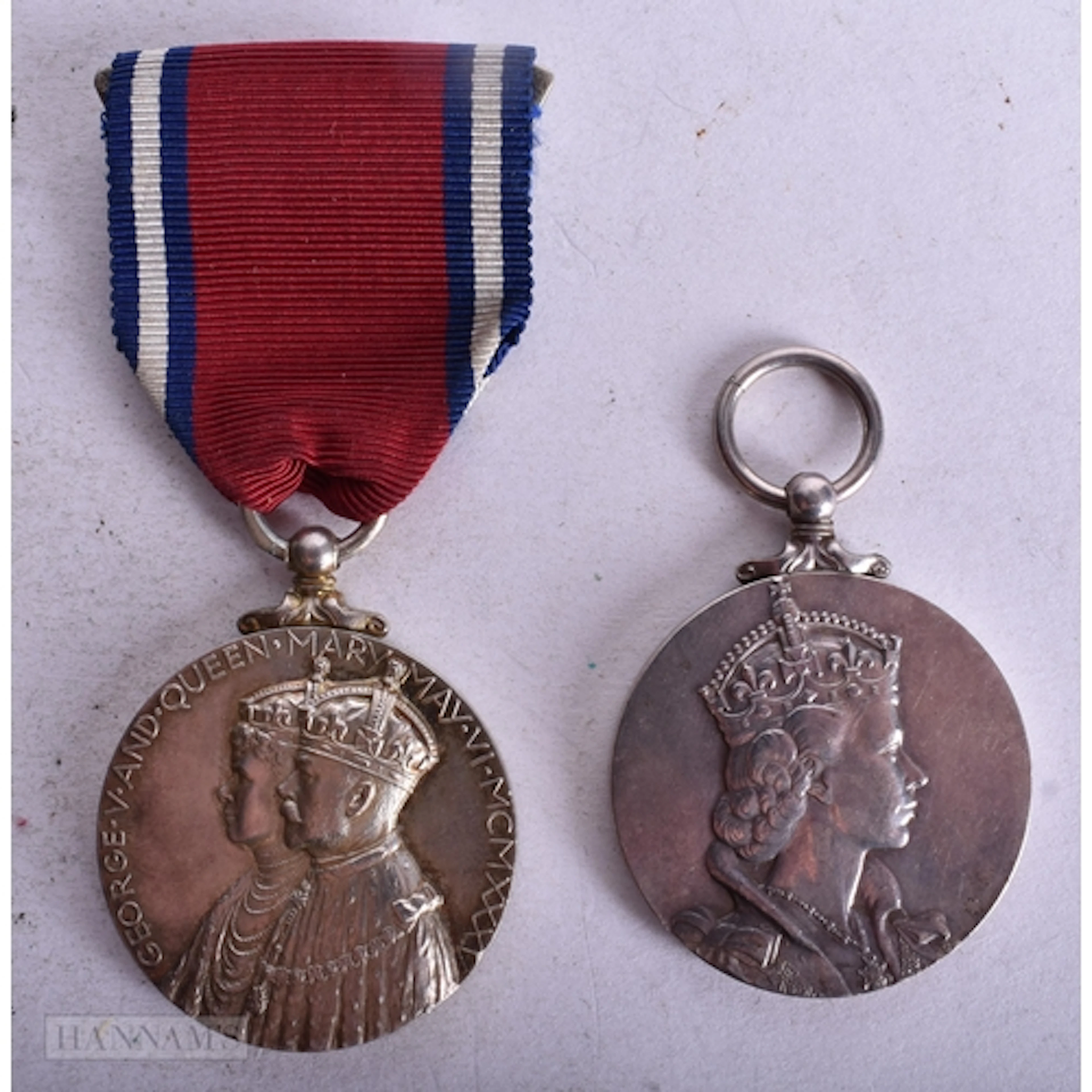 A George V and Queen Mary Silver Jubilee Medal together with...