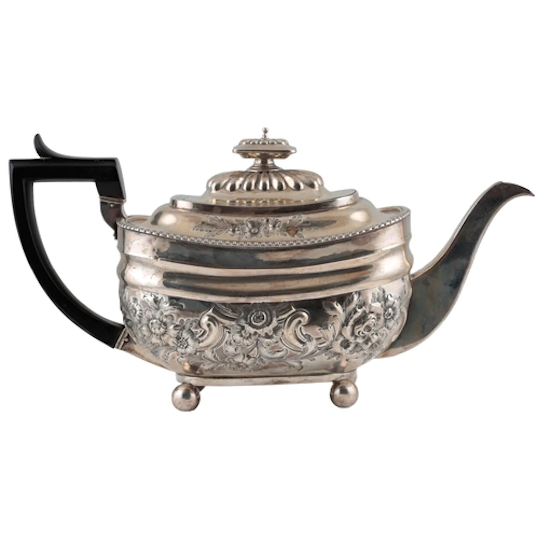 A George III silver teapot, with later embossed decoration, ...