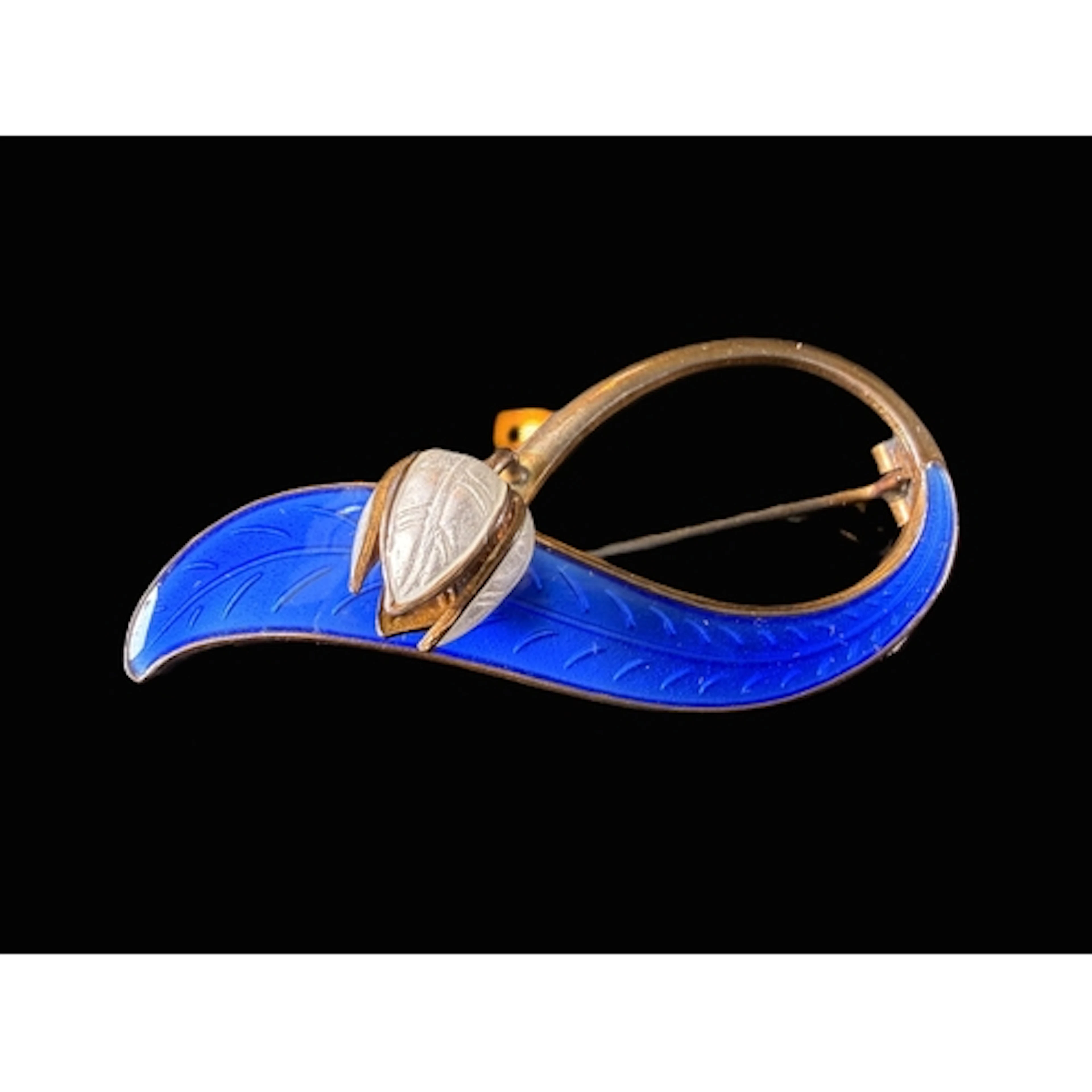 A Norwegian silver gilt brooch with blue enamel elongated 'l...