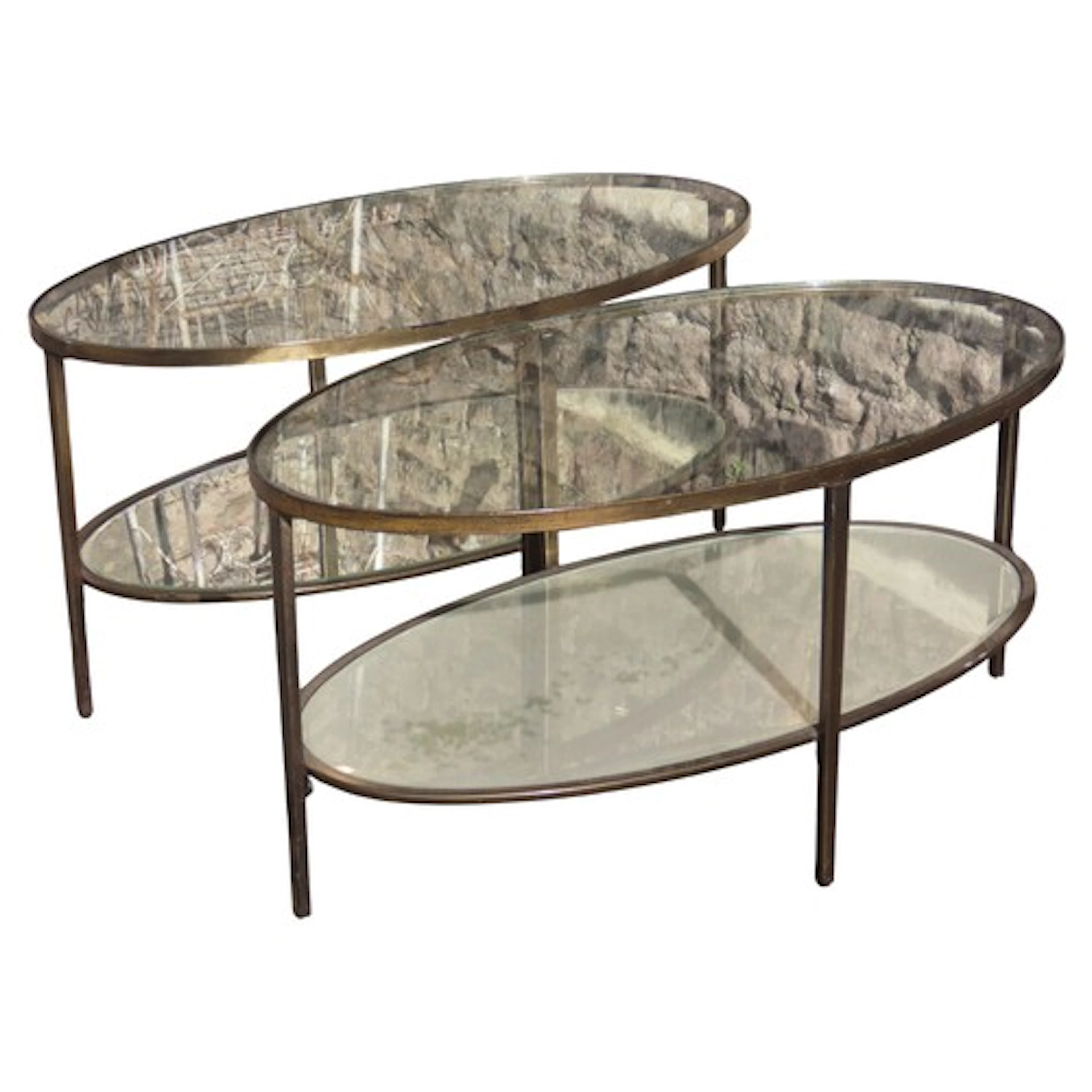 A pair oval lacquered brass effect two tier occasional table...