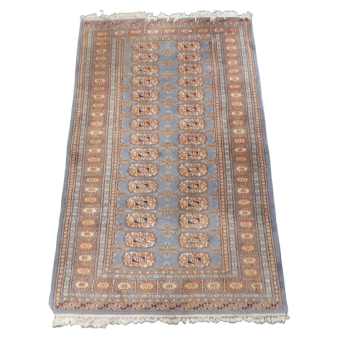 A blue ground Tekke rug with two rows of fifteen geometric l...
