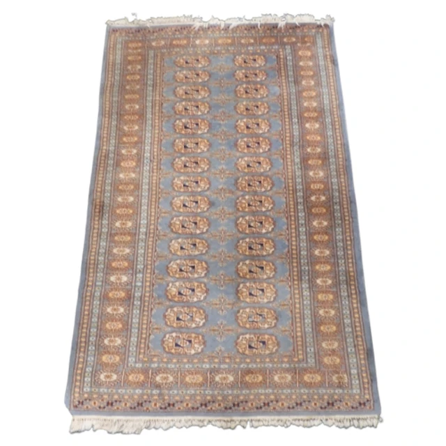 A blue ground Tekke rug with two rows of fifteen geometric l...