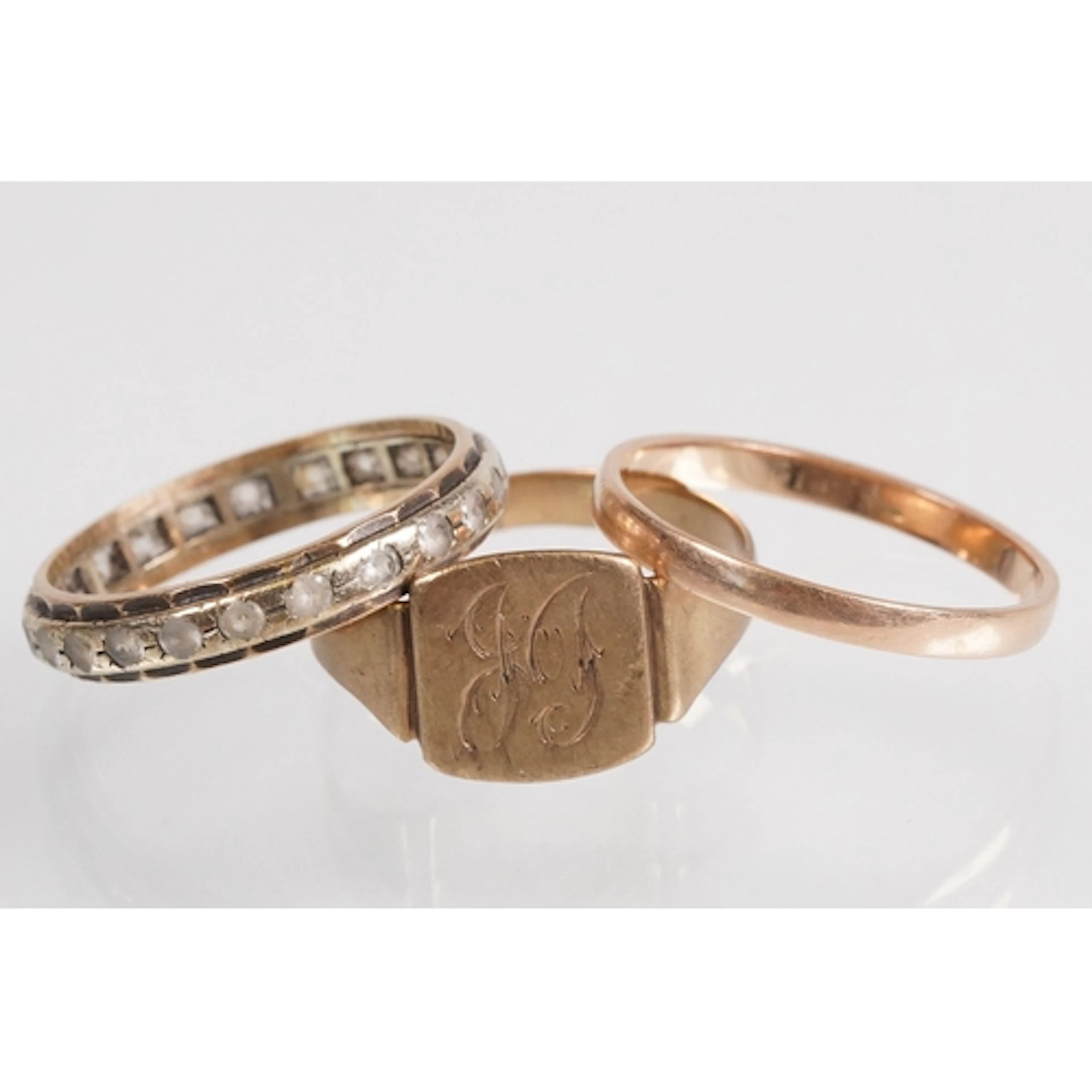 Group of rings to include a two tone white stone eternity ri...
