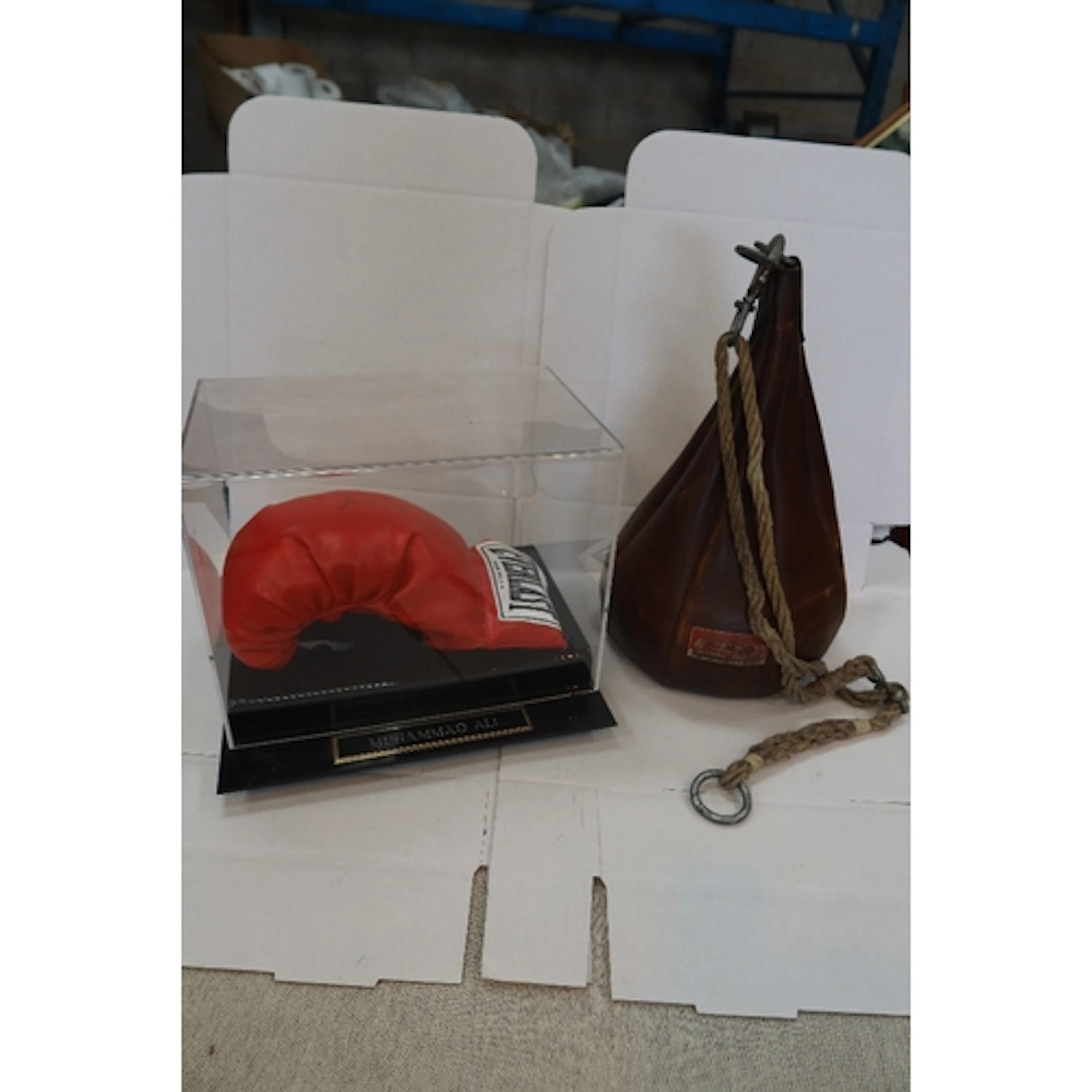 A signed Ali glove and Punch Ball