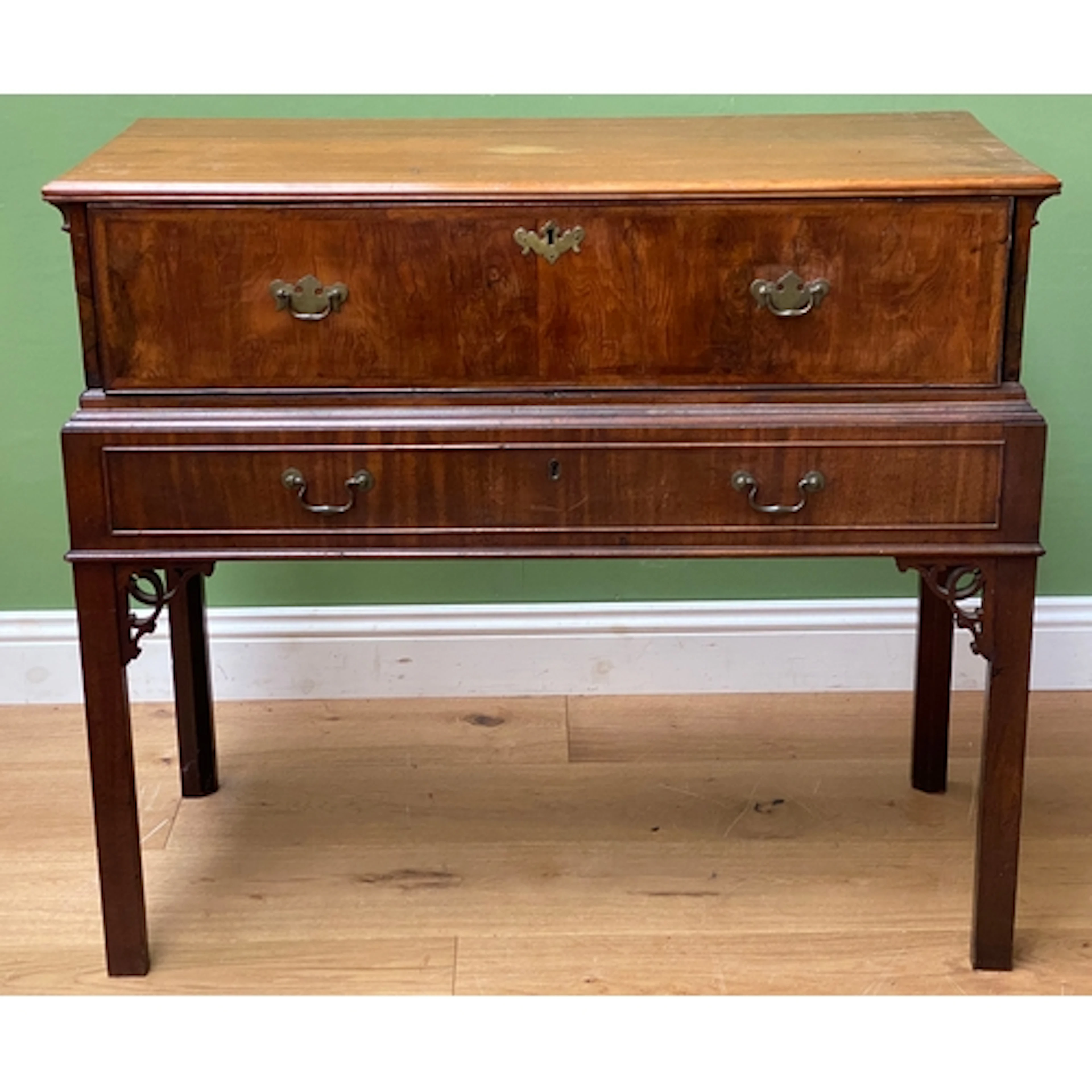 A walnut secretaire with fitted secretaire drawer over a fur...