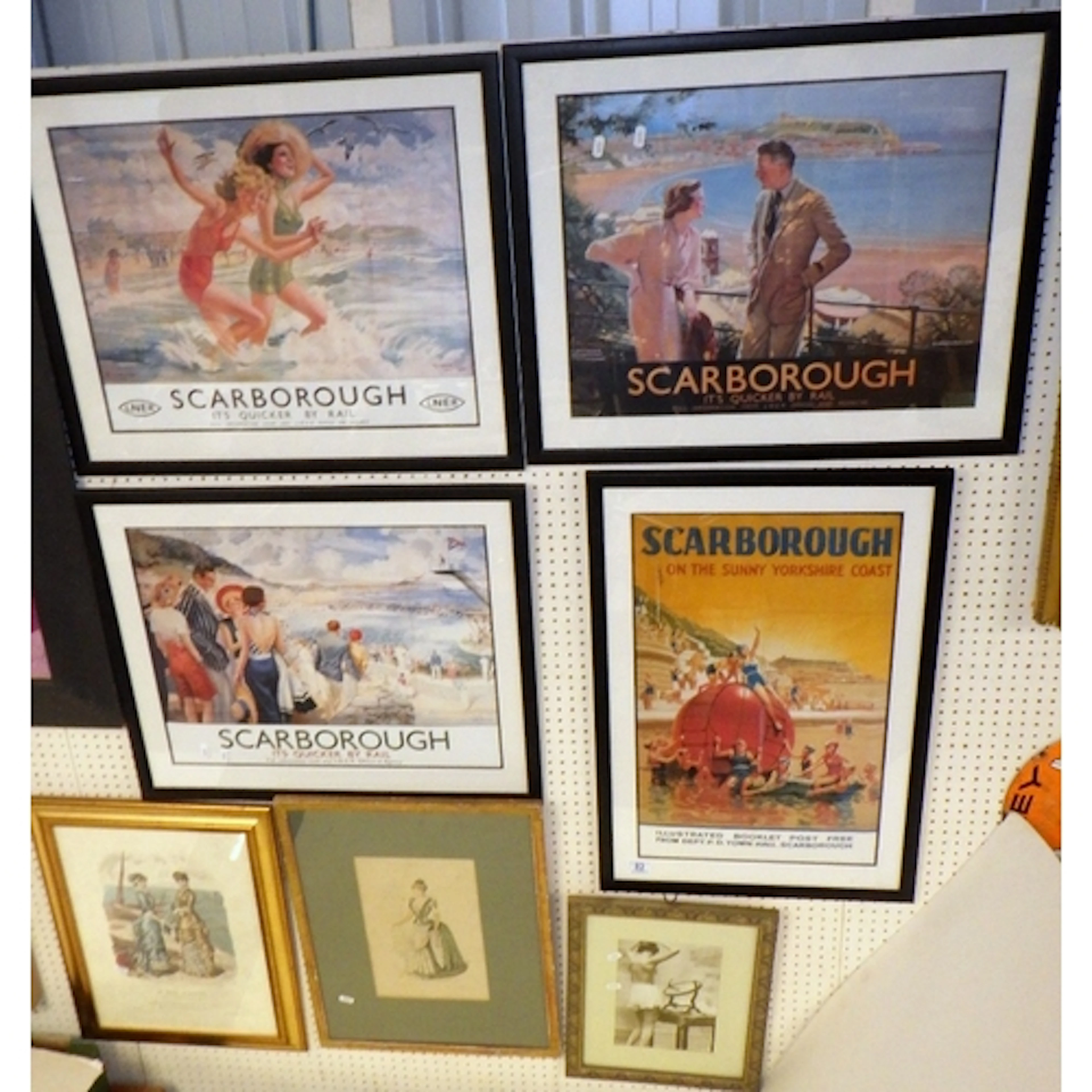 A group of four framed seaside poster prints together with t...