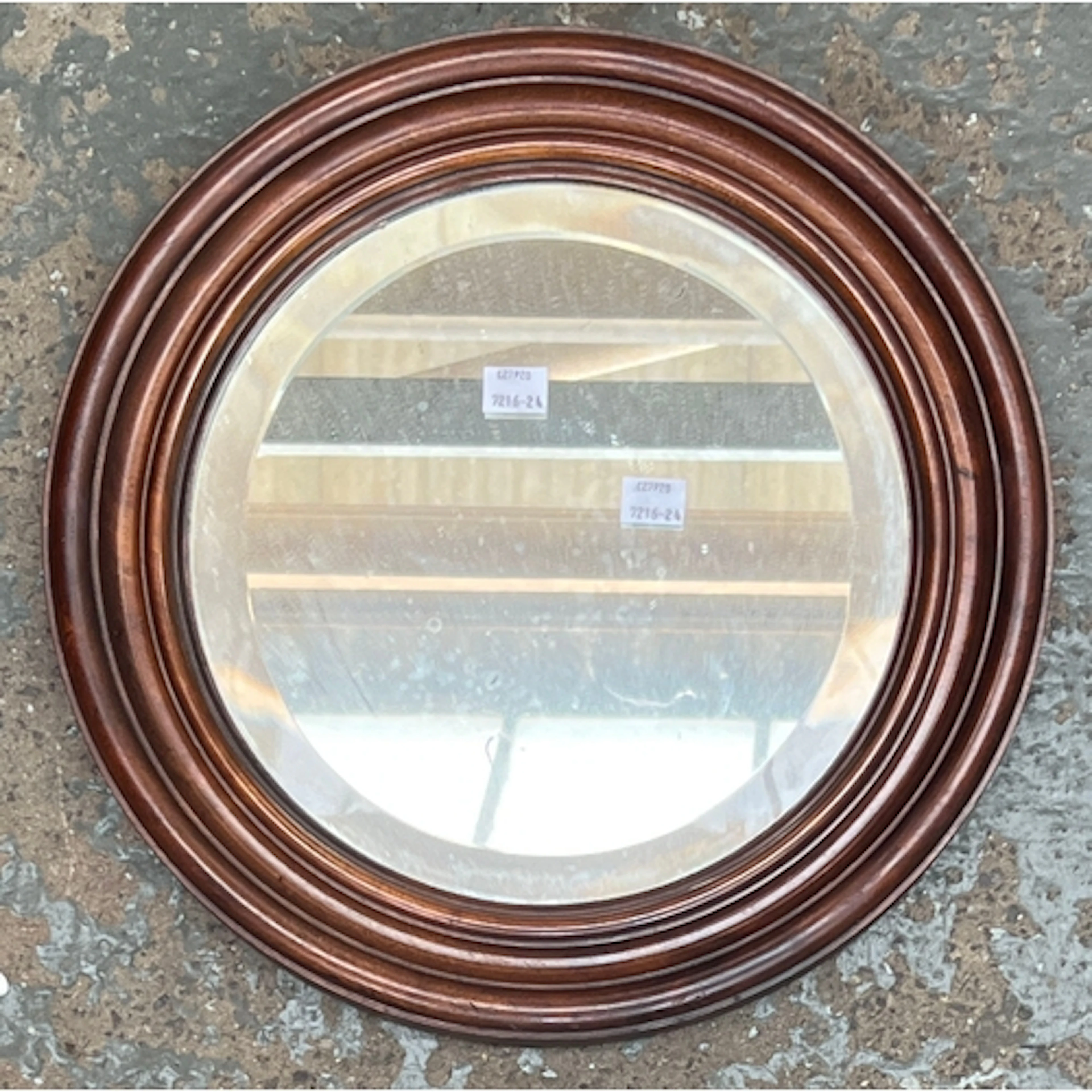 A mahogany framed circular mirror with bevelled plate, 37cmD...