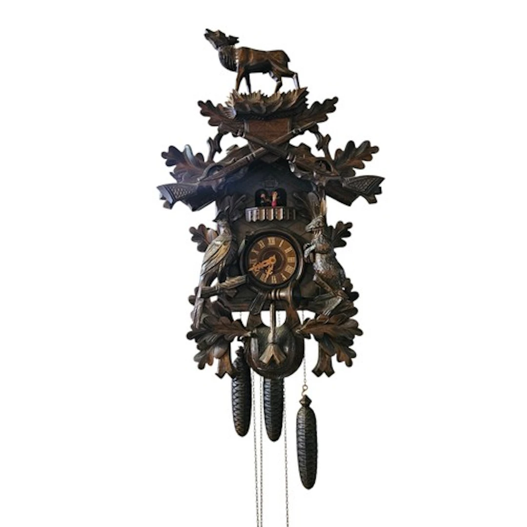 A VINTAGE BLACK FOREST CUCKOO CLOCK Crested with a mouse abo...