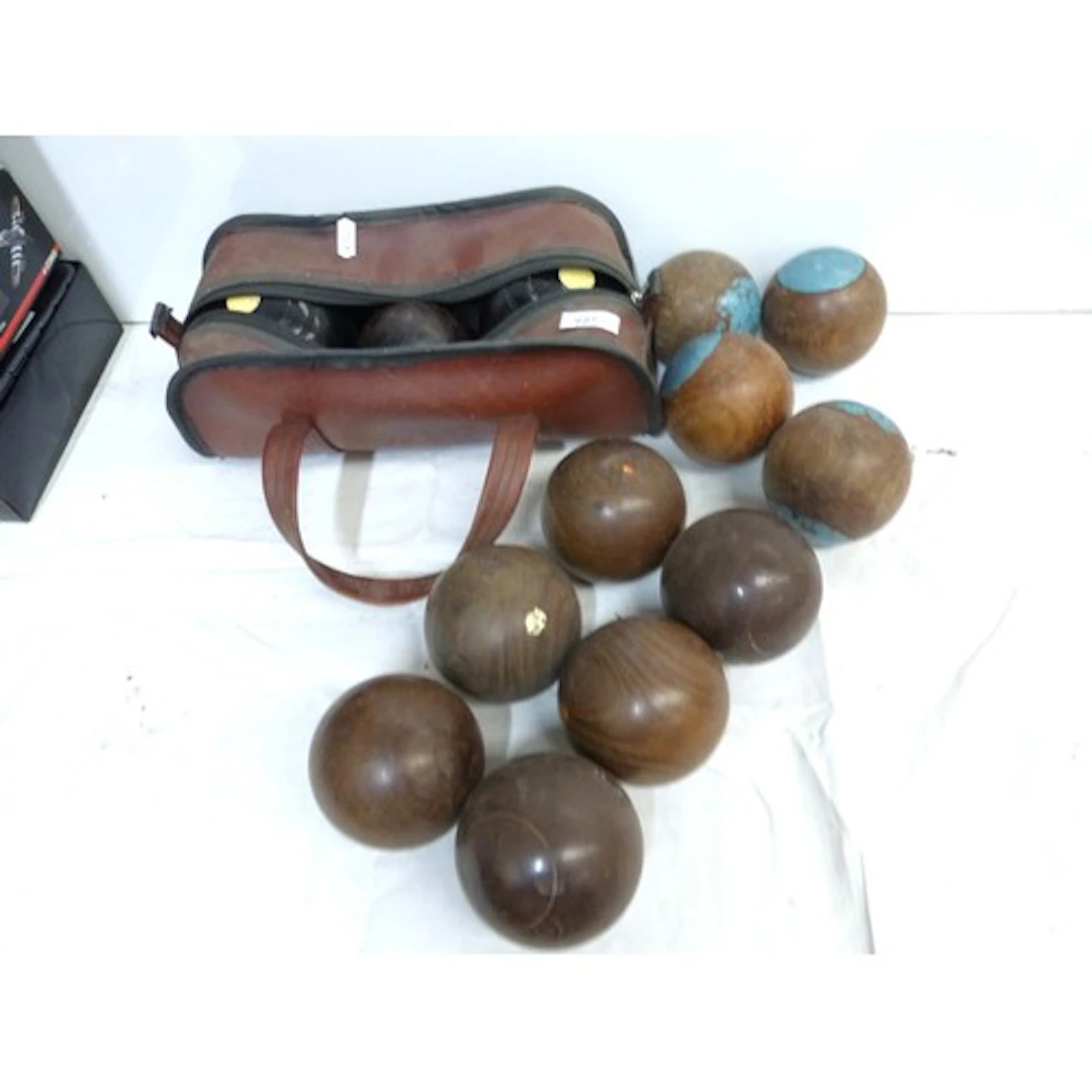 Collection of various antique lawn bowls.