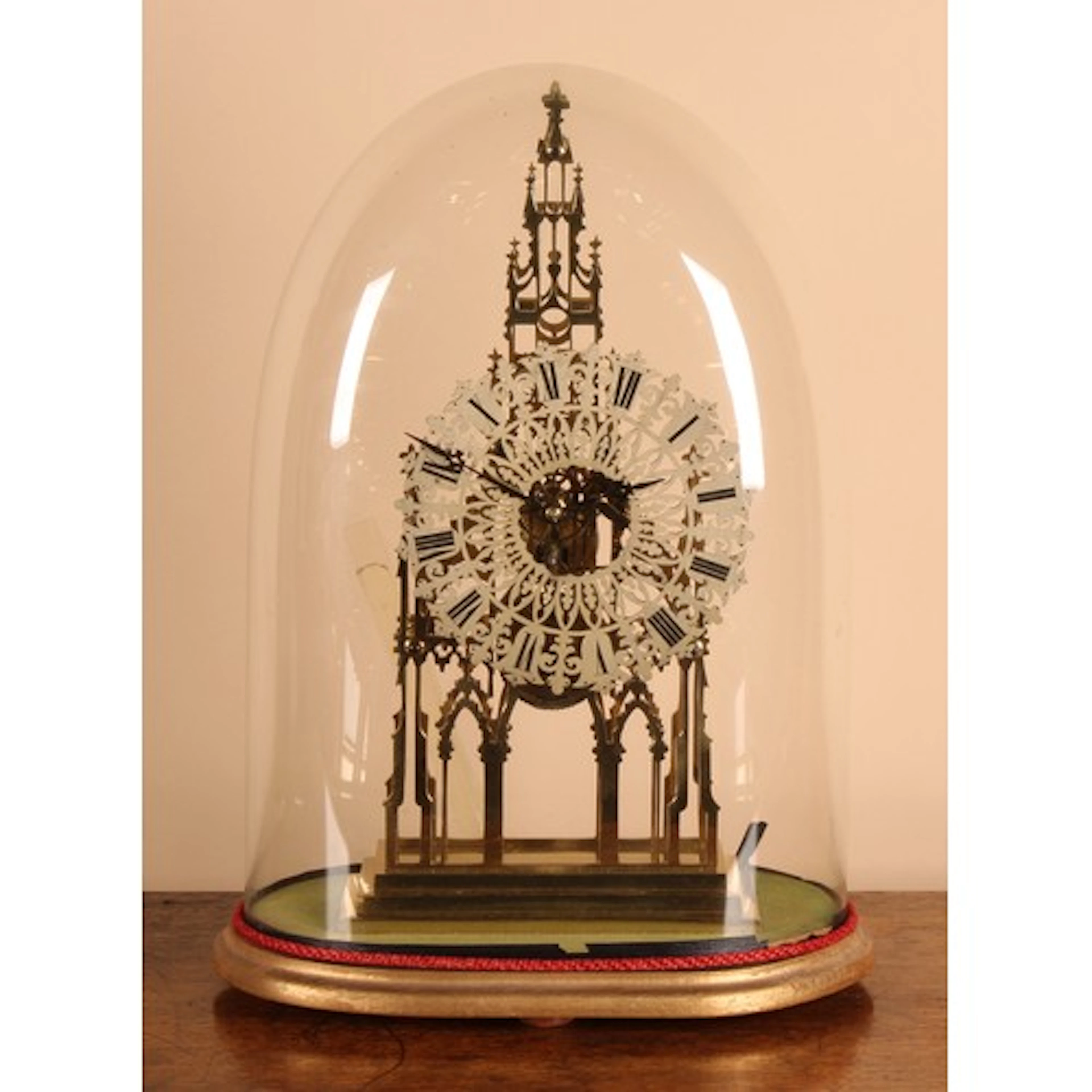 A Gothic Revival style architectural brass skeleton timepiec...