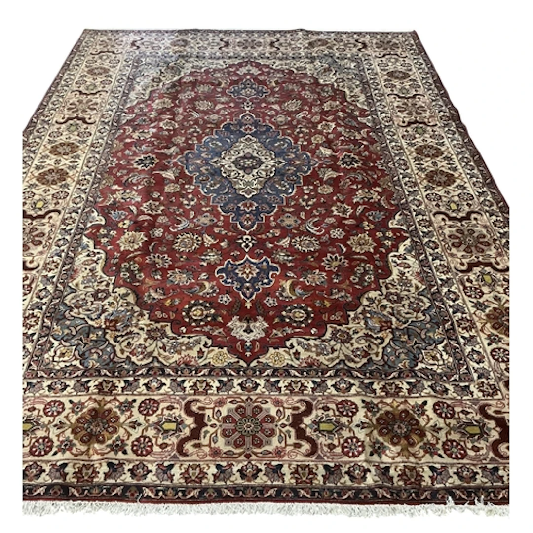 A Kashan ivory ground carpet, 350 x 248cm
